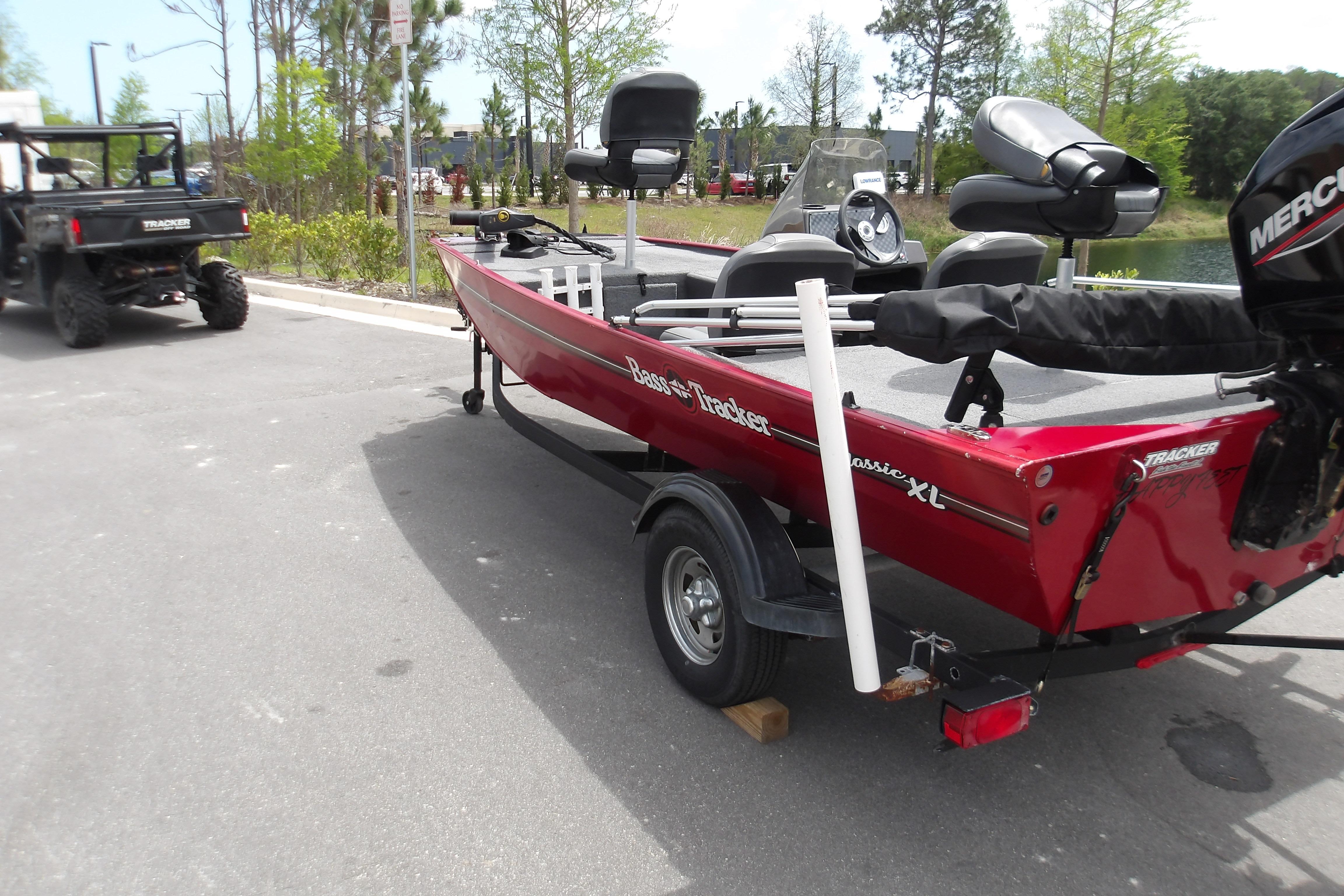 2024 Tracker Bass Tracker Classic XL boat on trailer, parked outdoors.