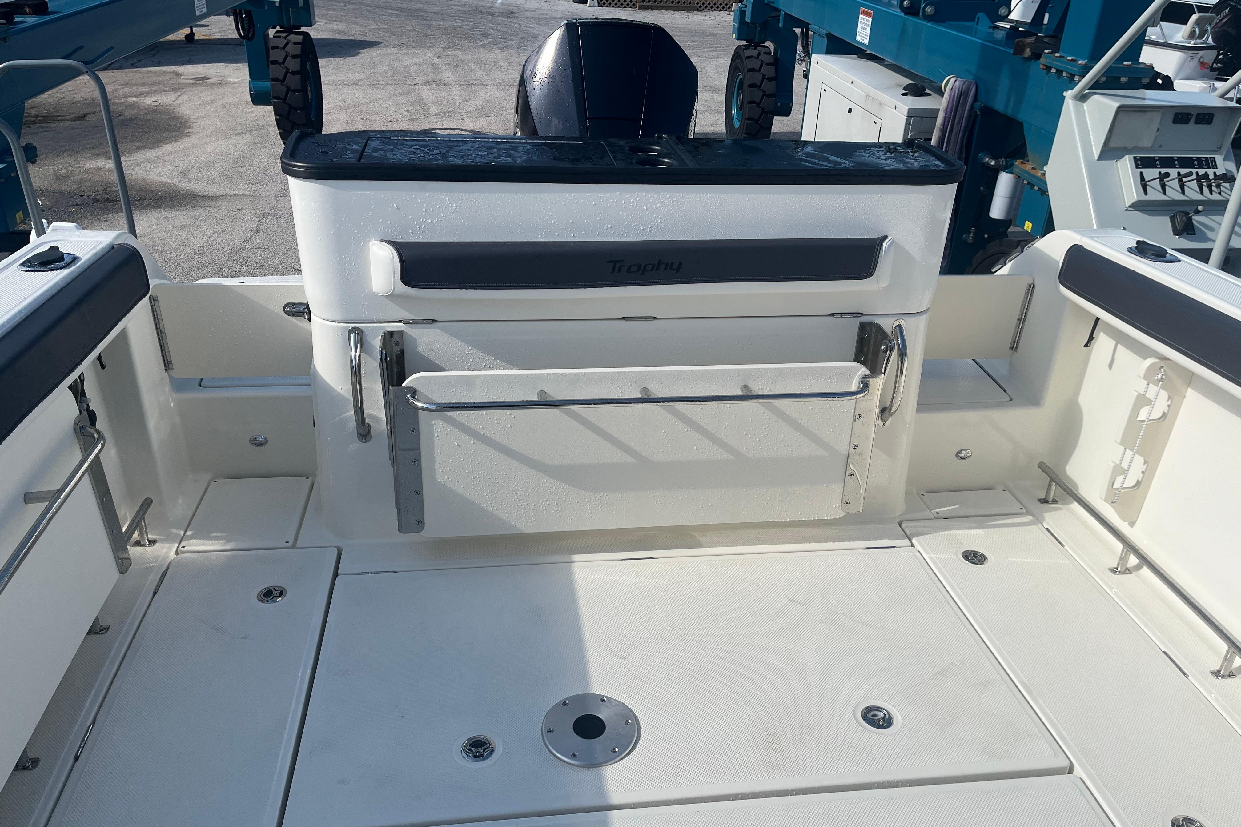 2025 Bayliner Trophy T25 Pilothouse boat deck with seating and storage compartments.