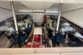 Engine room of 2013 Tiara Yachts 3100 Open, showcasing dual engines and mechanical components.