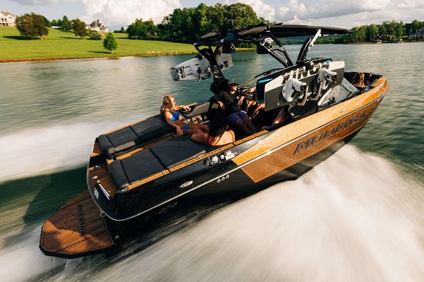 Manufacturer Provided Image: 2025 Moomba Mojo boat cruising on a lake with passengers enjoying the ride.