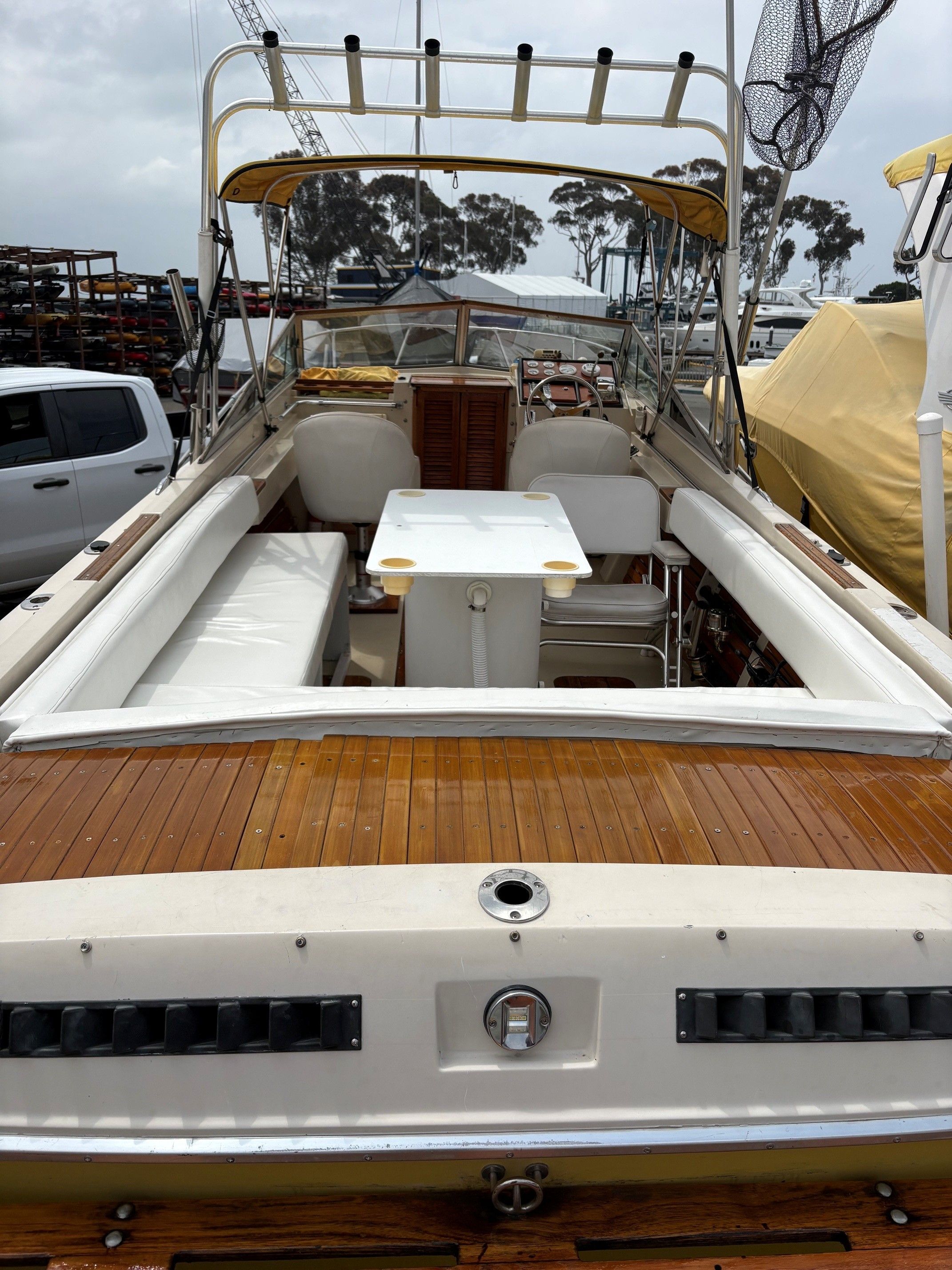 1979 Wellcraft Nova 250 boat with wooden deck and seating area.