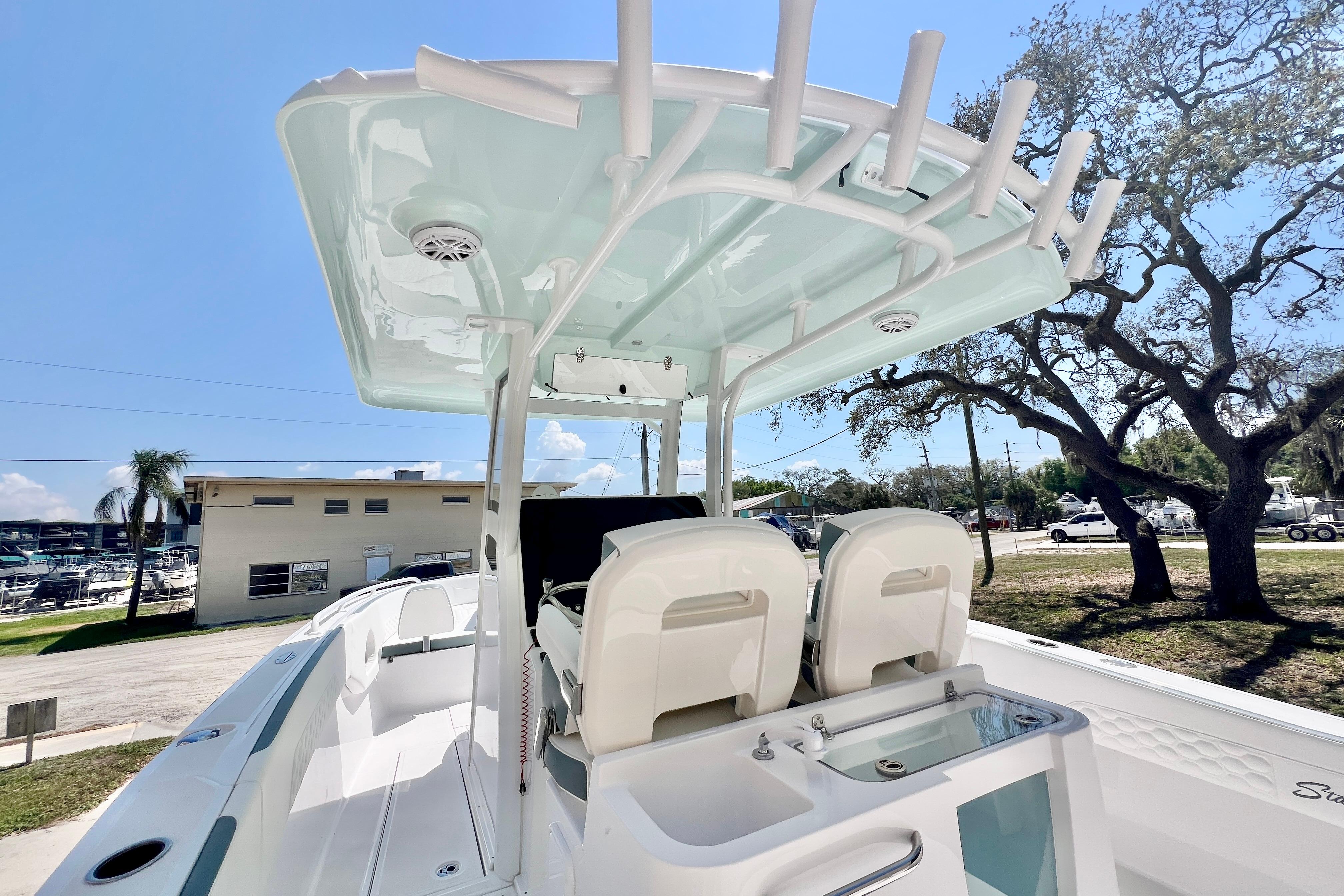 2026 Stamas 31T Aventura boat interior with seating and fishing rod holders.