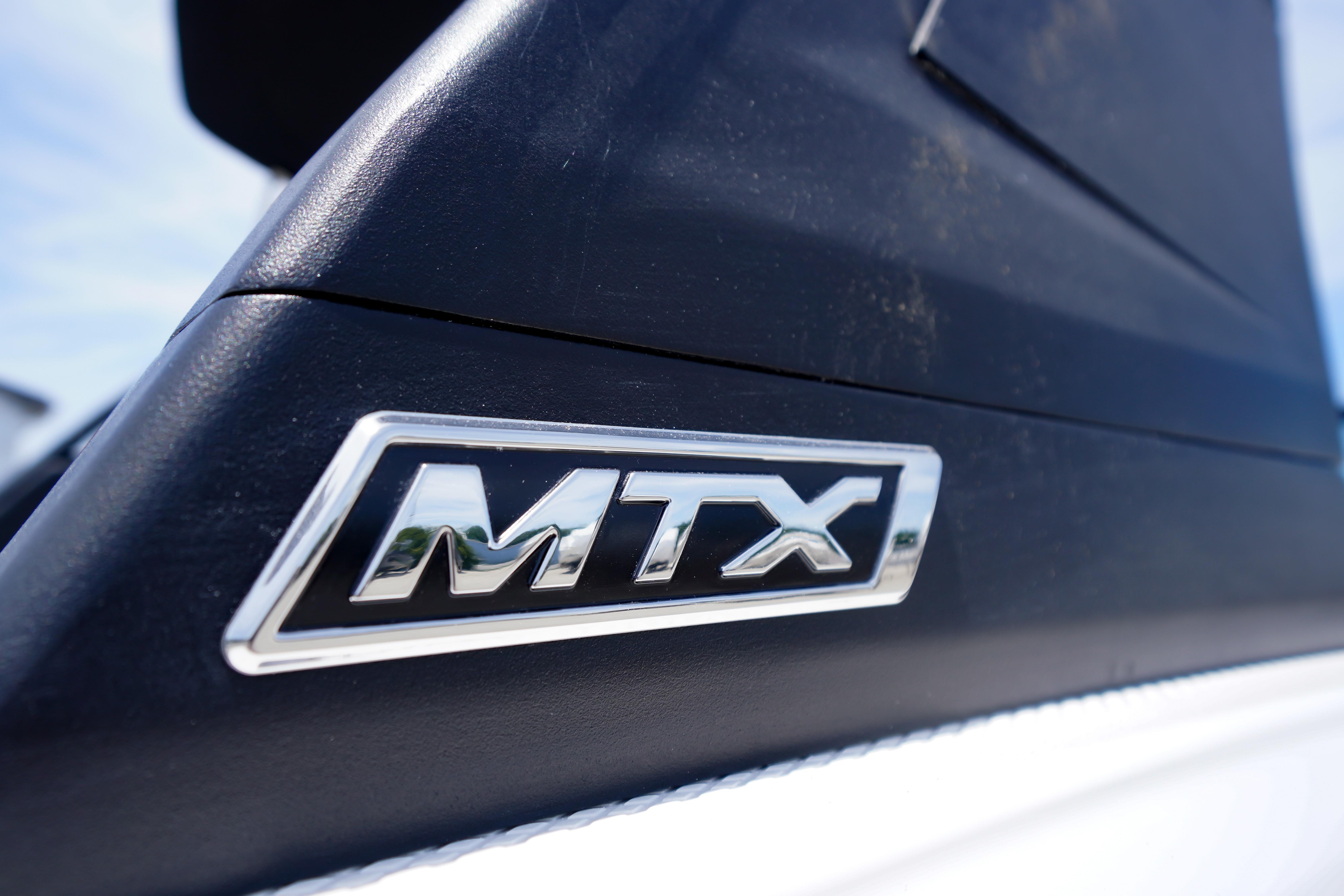 Close-up of MTX logo on 2026 Chaparral 23 SSi OB boat.