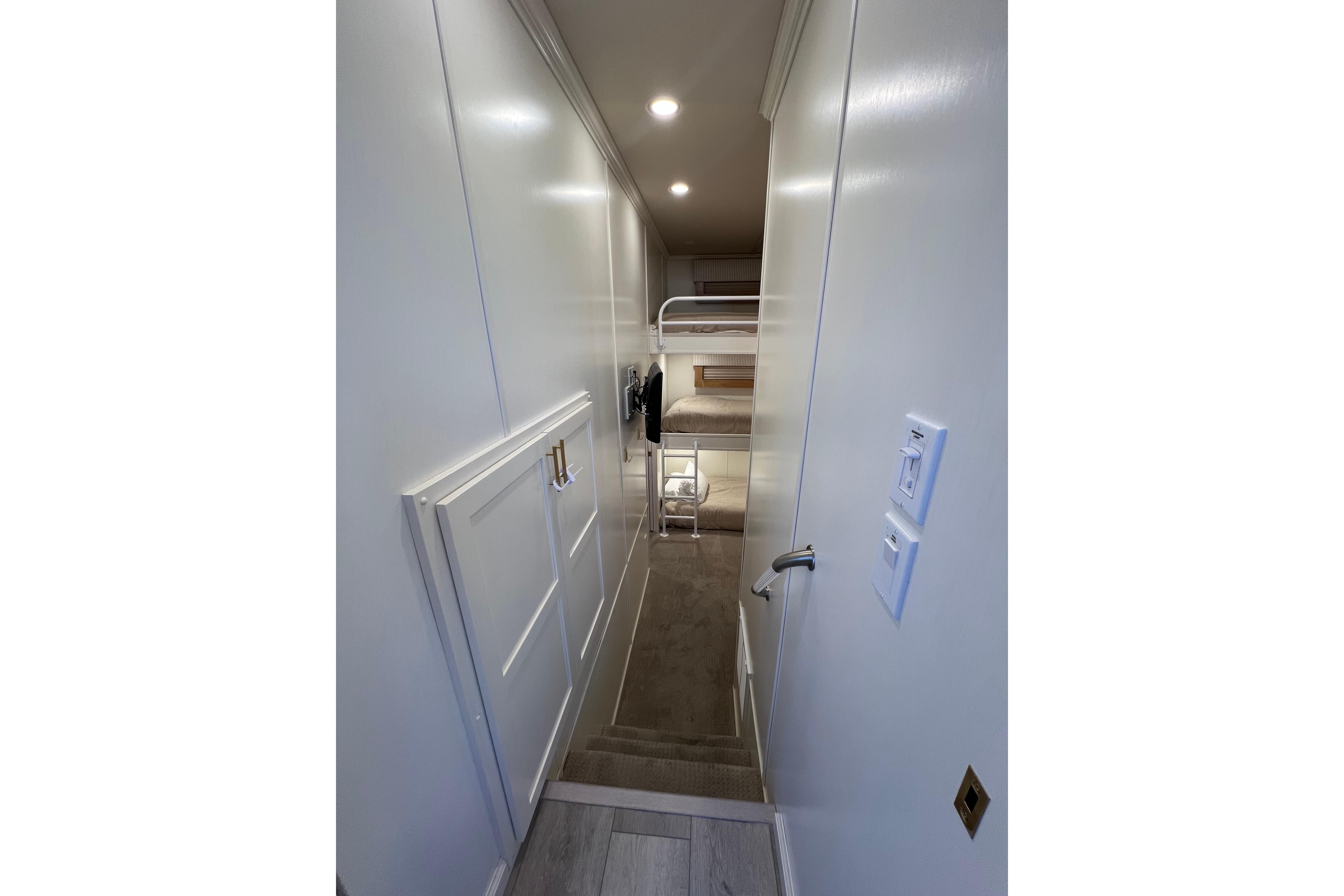 Narrow hallway with bunk beds in 2025 Sumerset Excellence Multiple Shares houseboat.