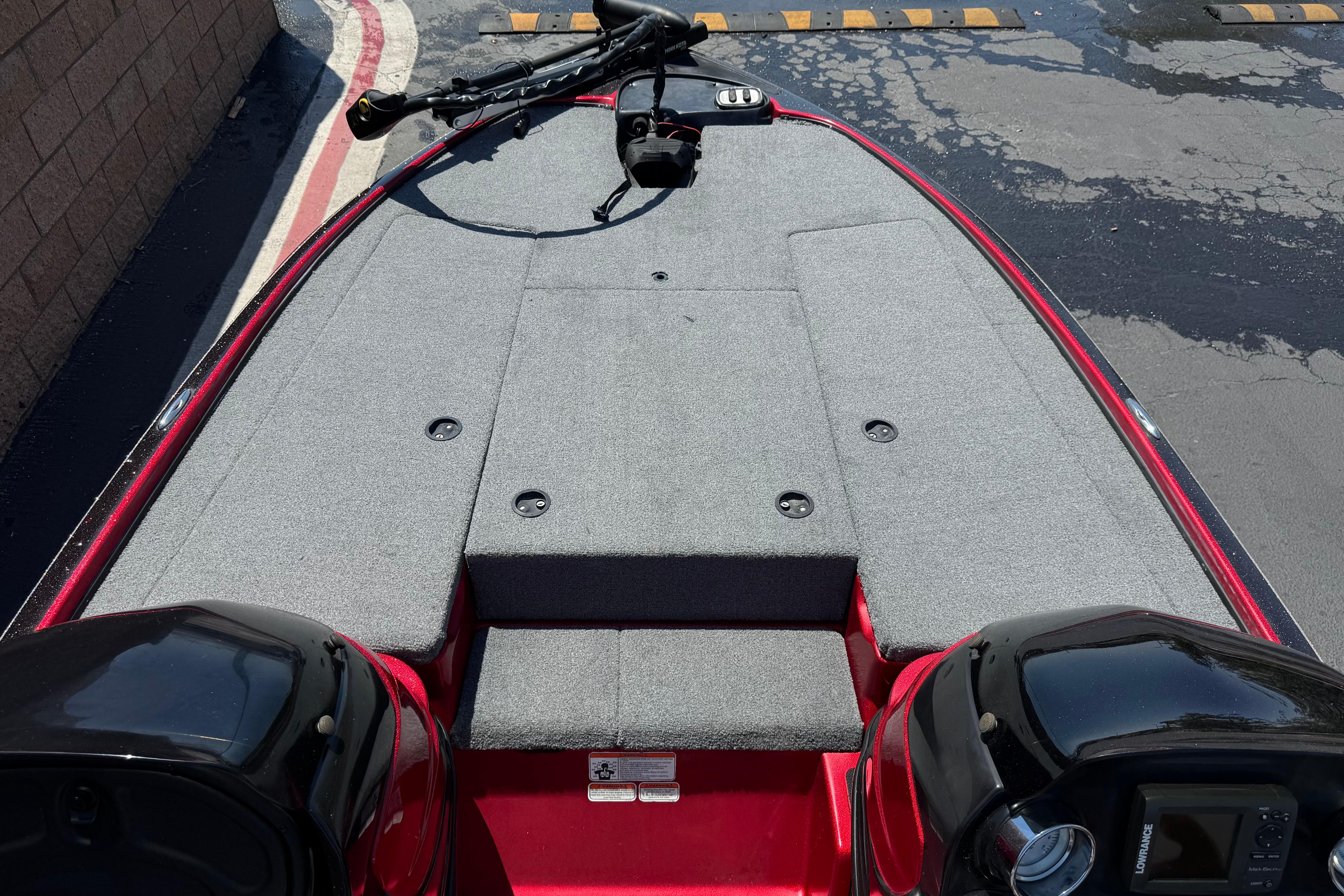 2012 Nitro Z-7 boat deck with gray carpeting and red trim.