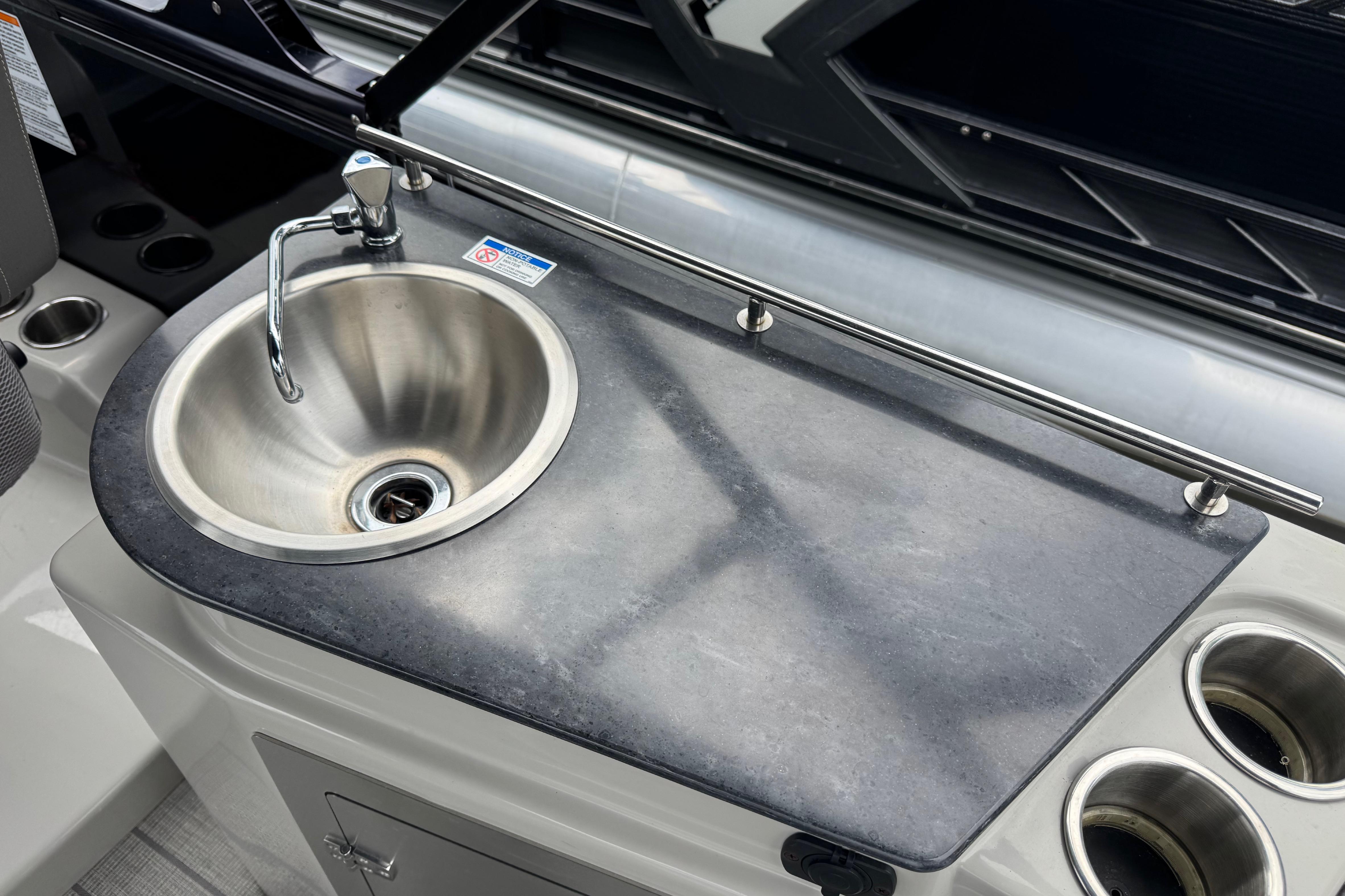 2023 Starcraft MX 25 DL DH boat sink with faucet and countertop.