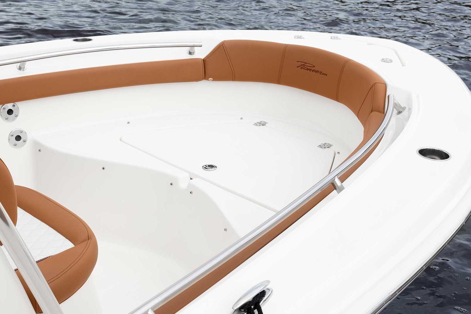 Manufacturer Provided Image: 2025 Pioneer 202 Islander boat interior with tan seating and stainless steel railings.