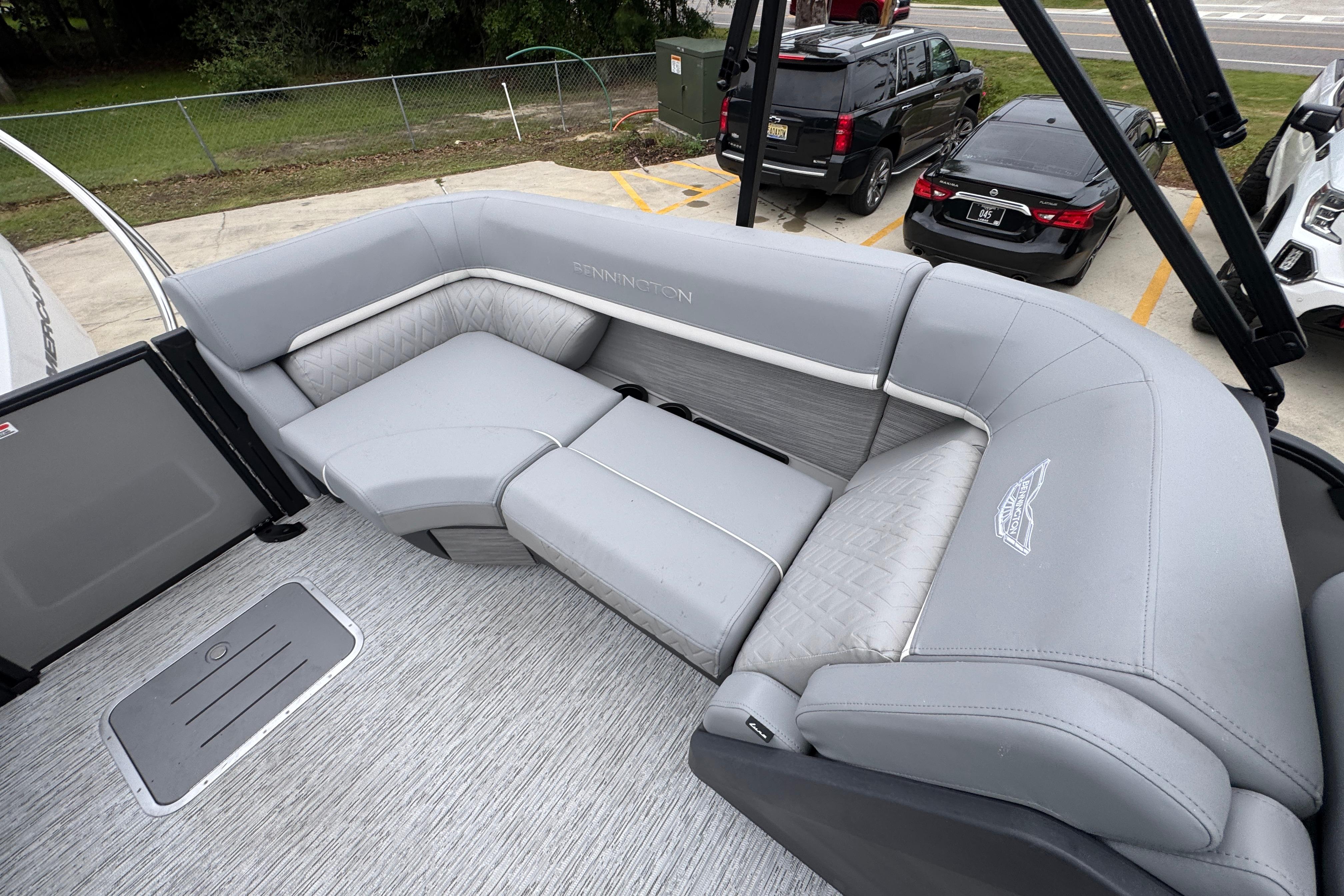 2027 Bennington 24 MFB boat interior with luxurious gray seating and modern design.