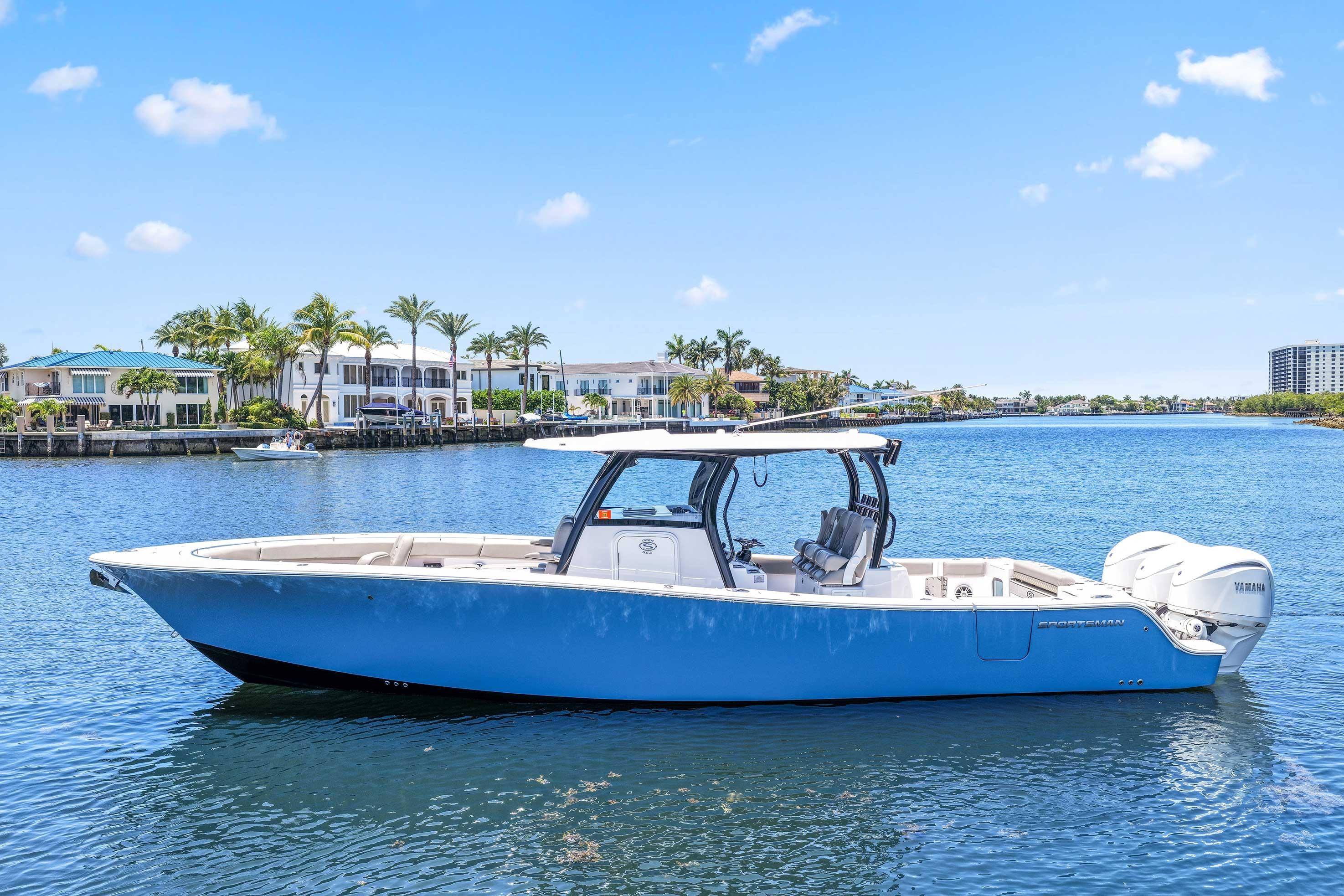 2024 Sportsman Open 352 Center Console boat on a sunny waterfront.