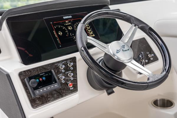 Manufacturer Provided Image: 2023 Sea Ray SPX 230 OB boat dashboard with steering wheel and control panel.