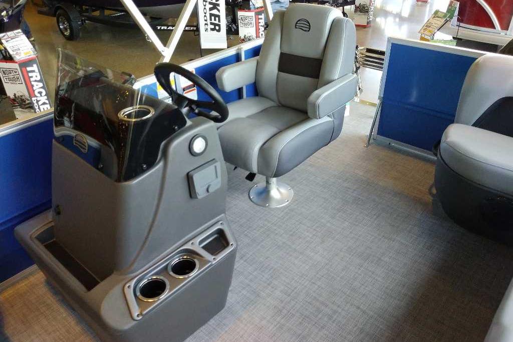 Interior of 2026 Sun Tracker Party Barge 16 DLX with steering console and seating.