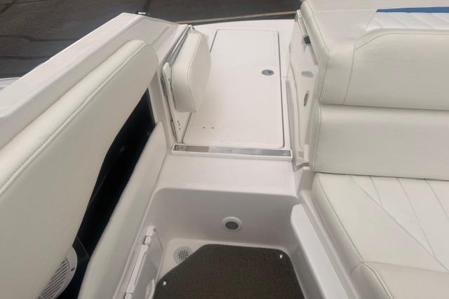 2007 Regal 2200 Bowrider interior with white seating and storage compartments.