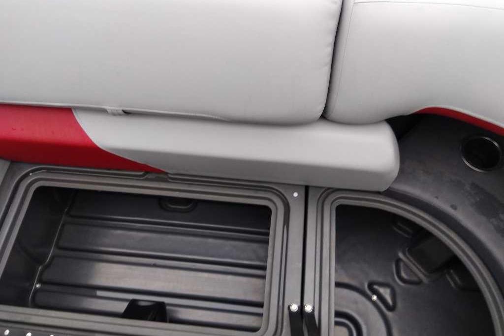 2026 Sun Tracker Party Barge 22 XP3 storage compartment with cushioned seating.