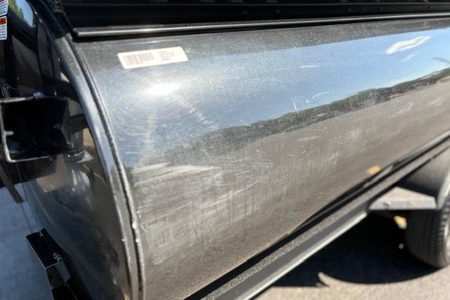 2025 Regency 250 DL3 boat exterior with visible surface scratches and reflections.