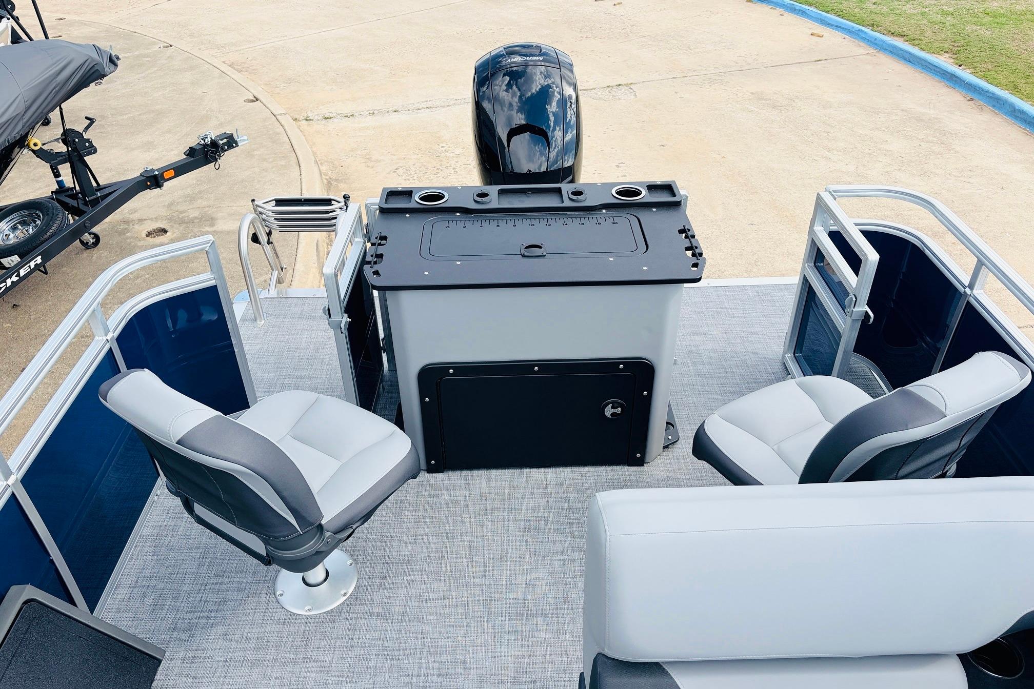 2026 Sun Tracker SportFish 22 DLX pontoon boat interior with seating and control console.