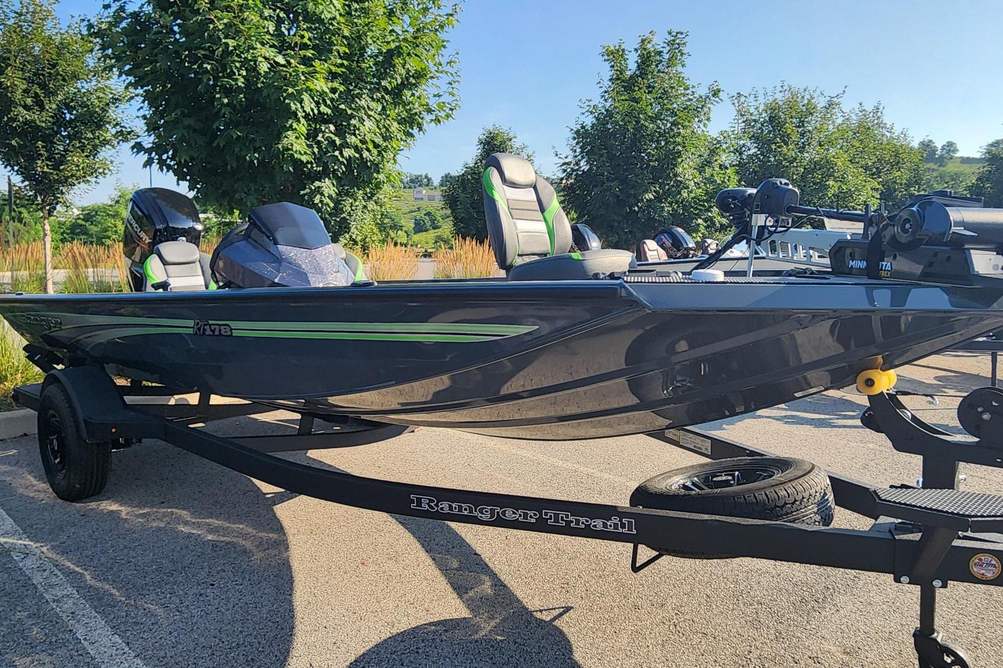 2026 Ranger RT178 boat on trailer, parked outdoors, featuring sleek design and modern equipment.