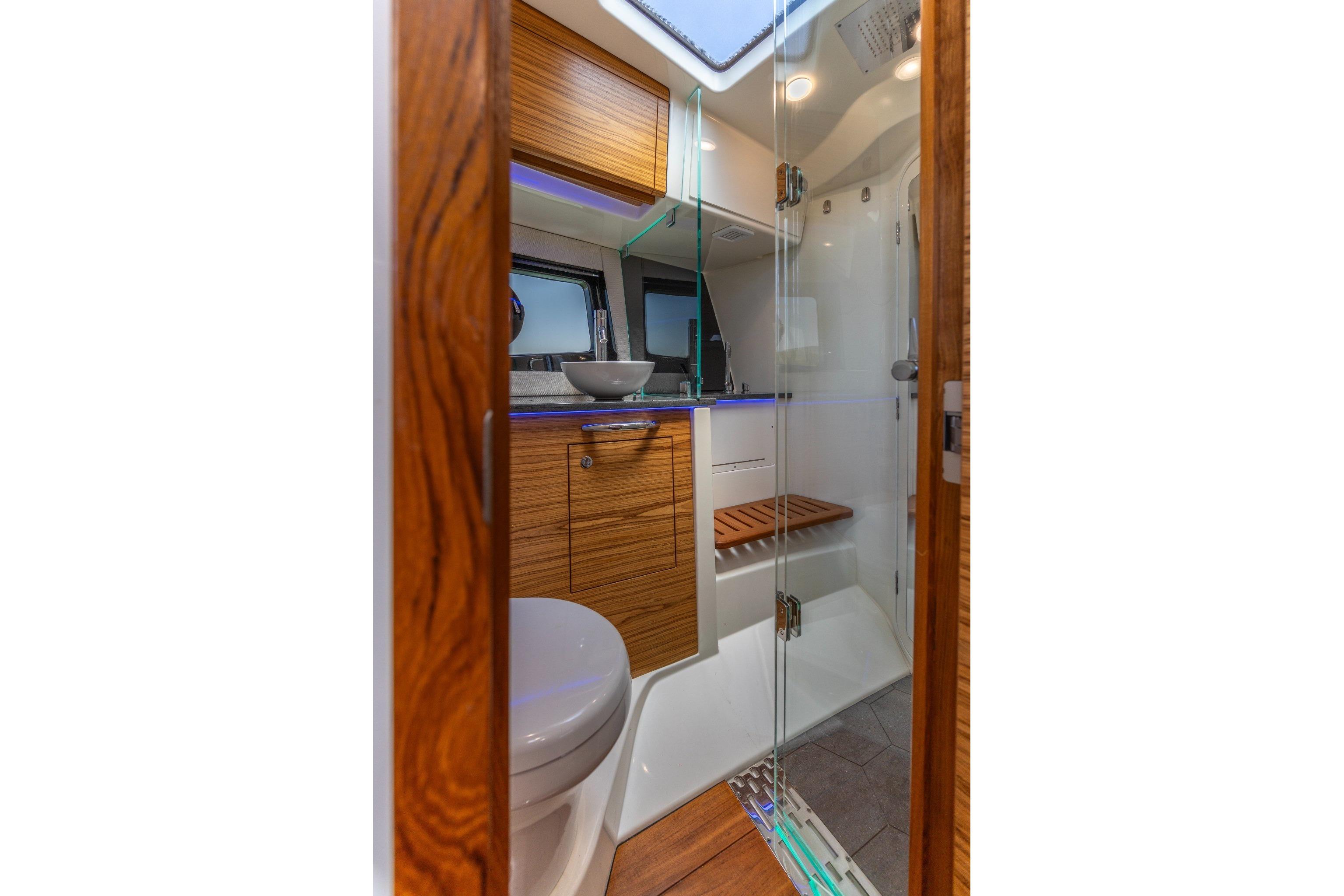 Luxurious bathroom interior of 2023 Boston Whaler 405 Conquest boat with modern fixtures.