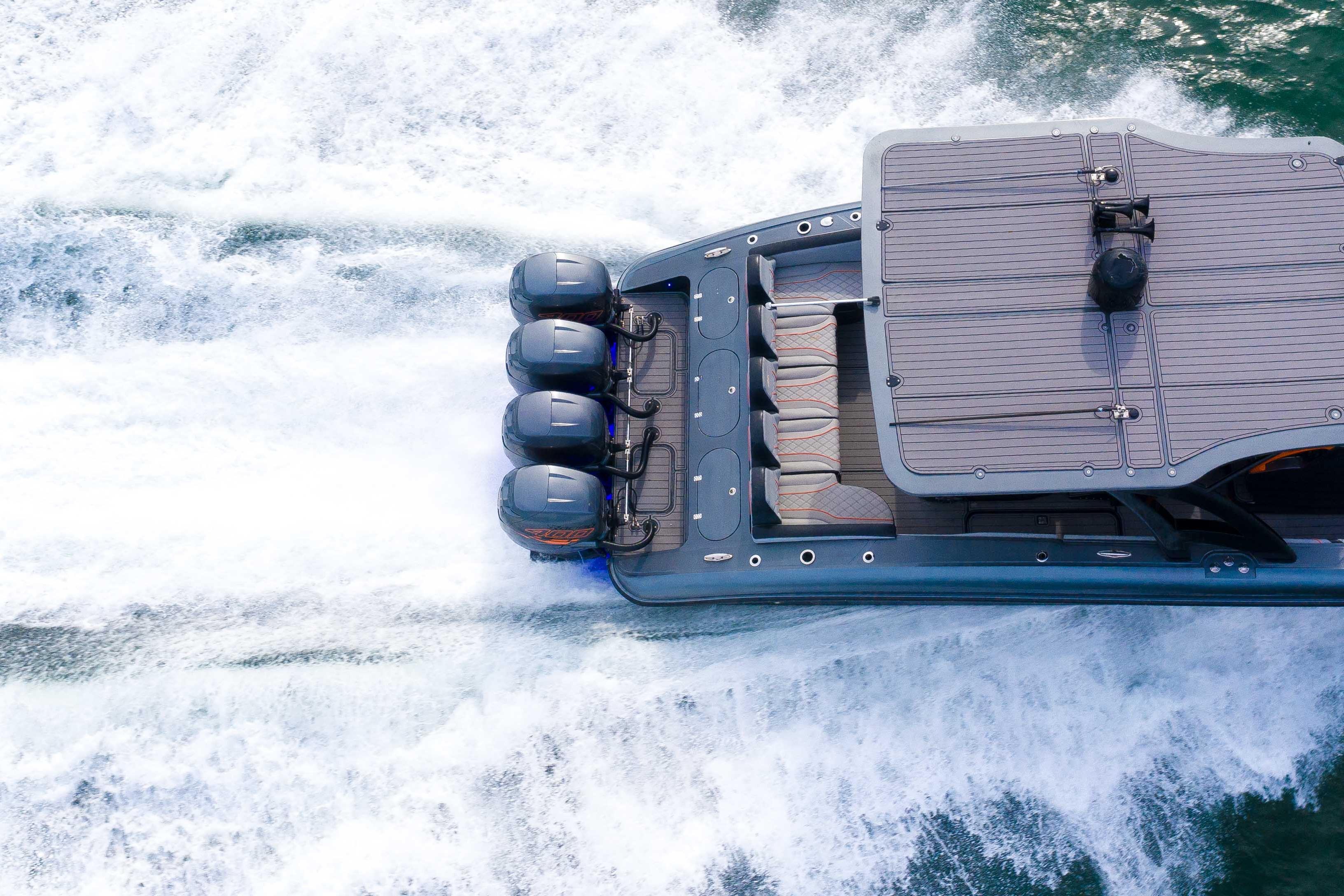 2019 Midnight Express 43 Open boat speeding on water, aerial view.