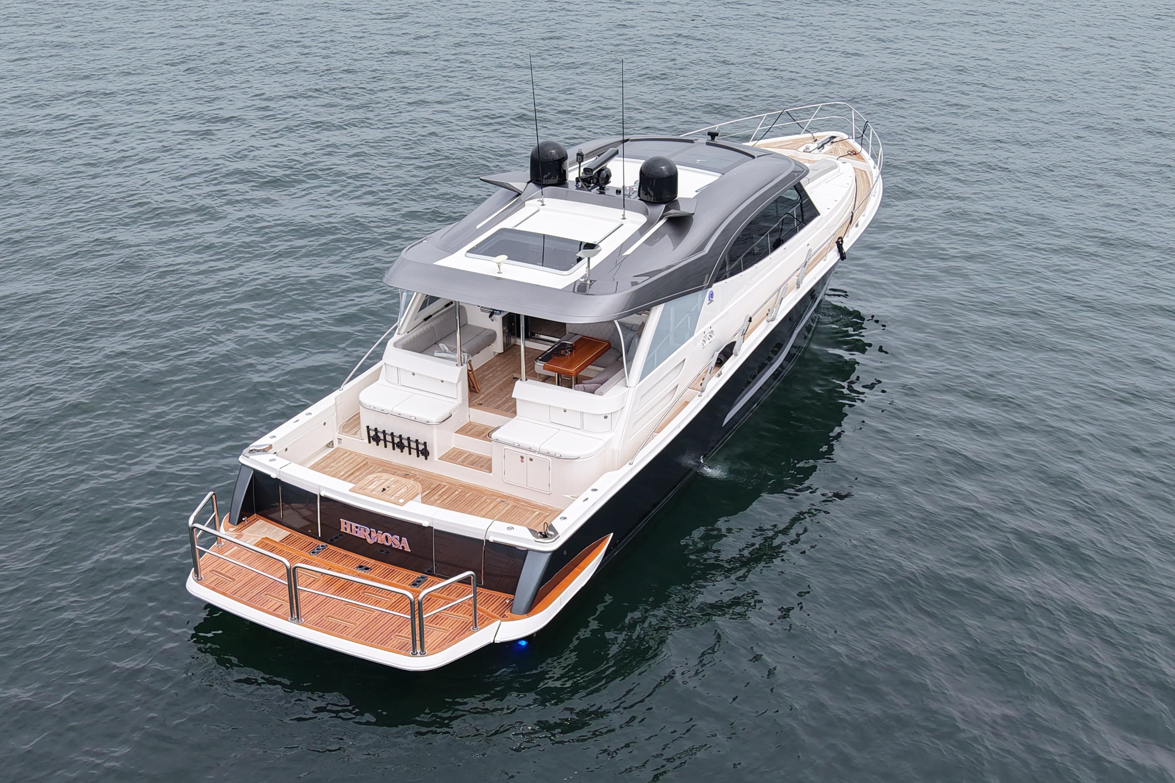 2023 Riviera 645 SUV luxury yacht cruising on open water.