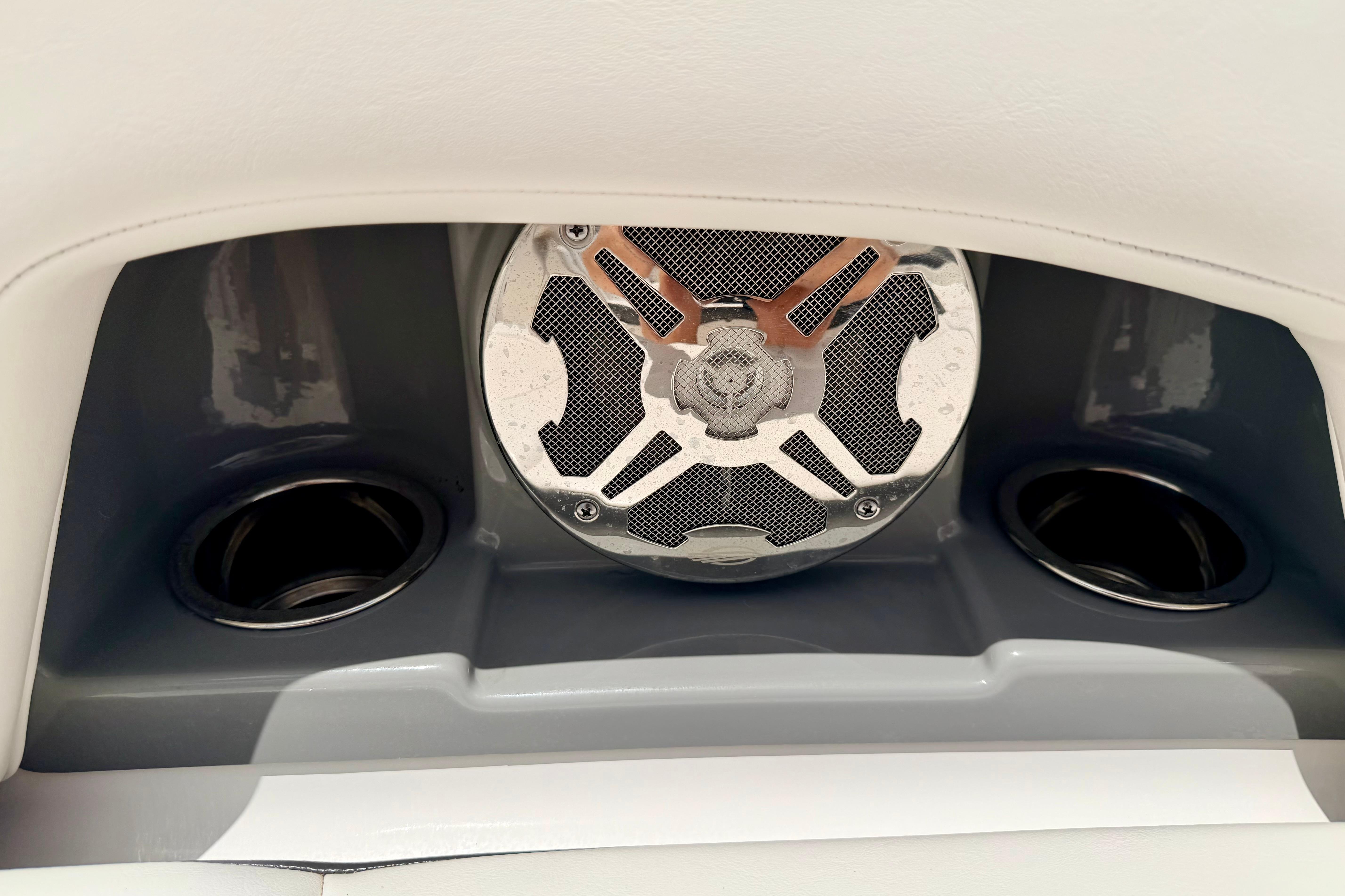 Speaker and cup holders on 2015 Chaparral Sunesta 264 boat interior.