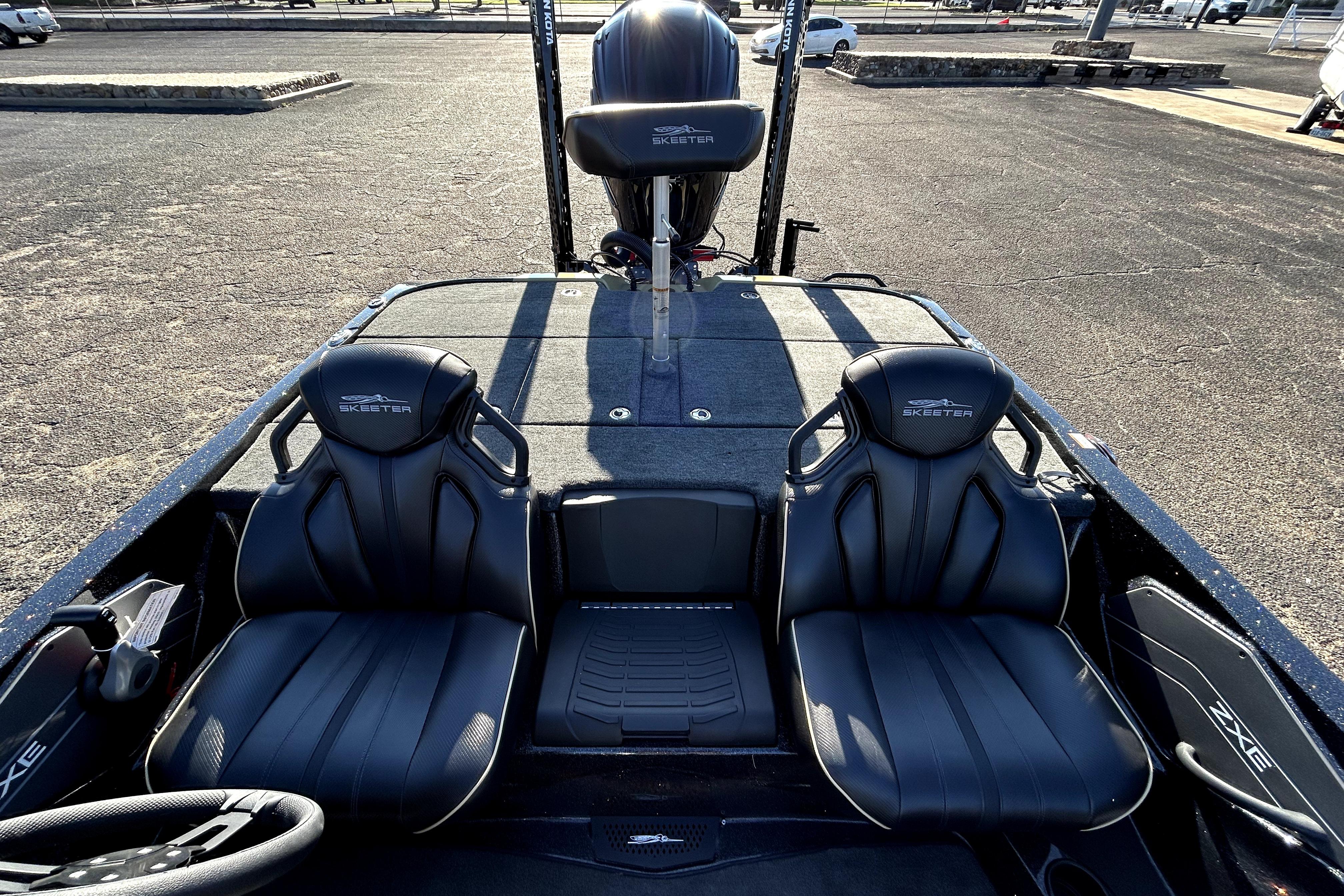 2026 Skeeter ZXE21 boat interior with black seats and steering wheel.