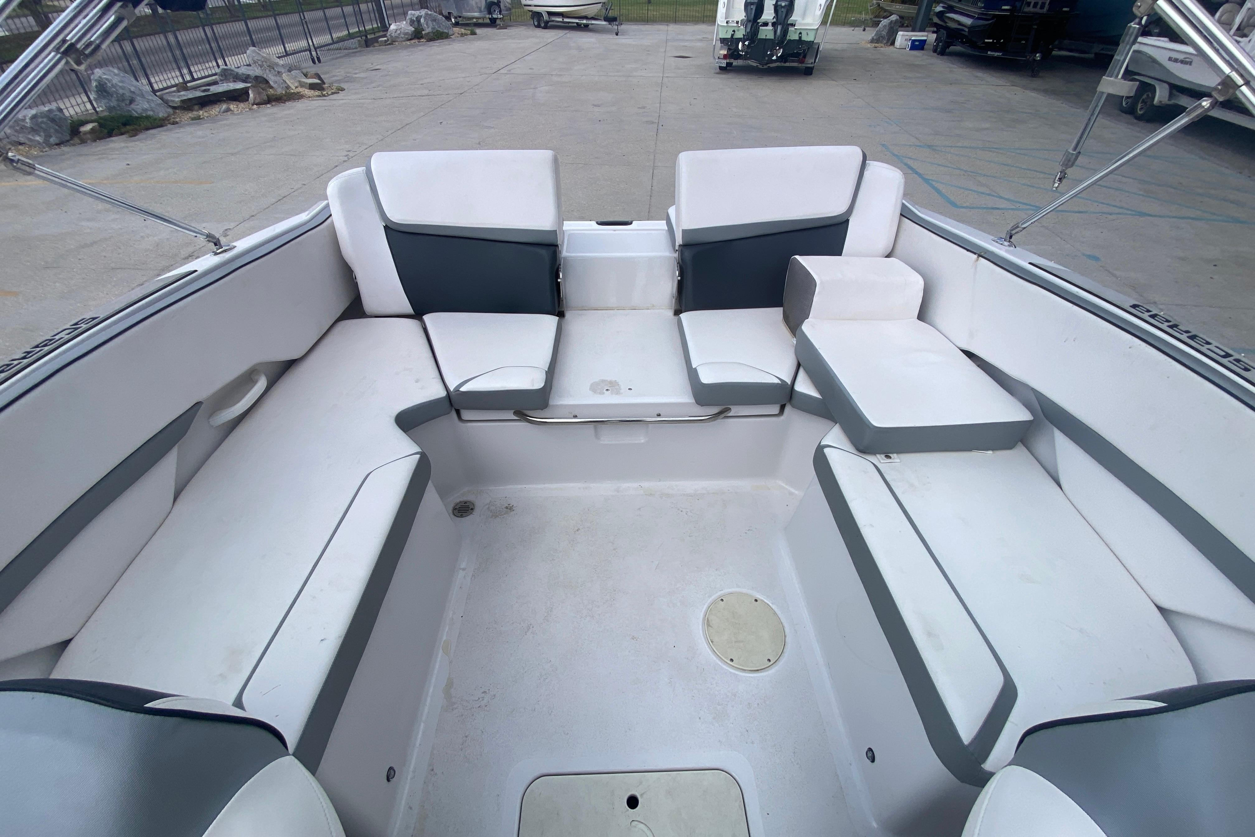 Spacious interior of 2018 Scarab 215 G boat with comfortable seating.