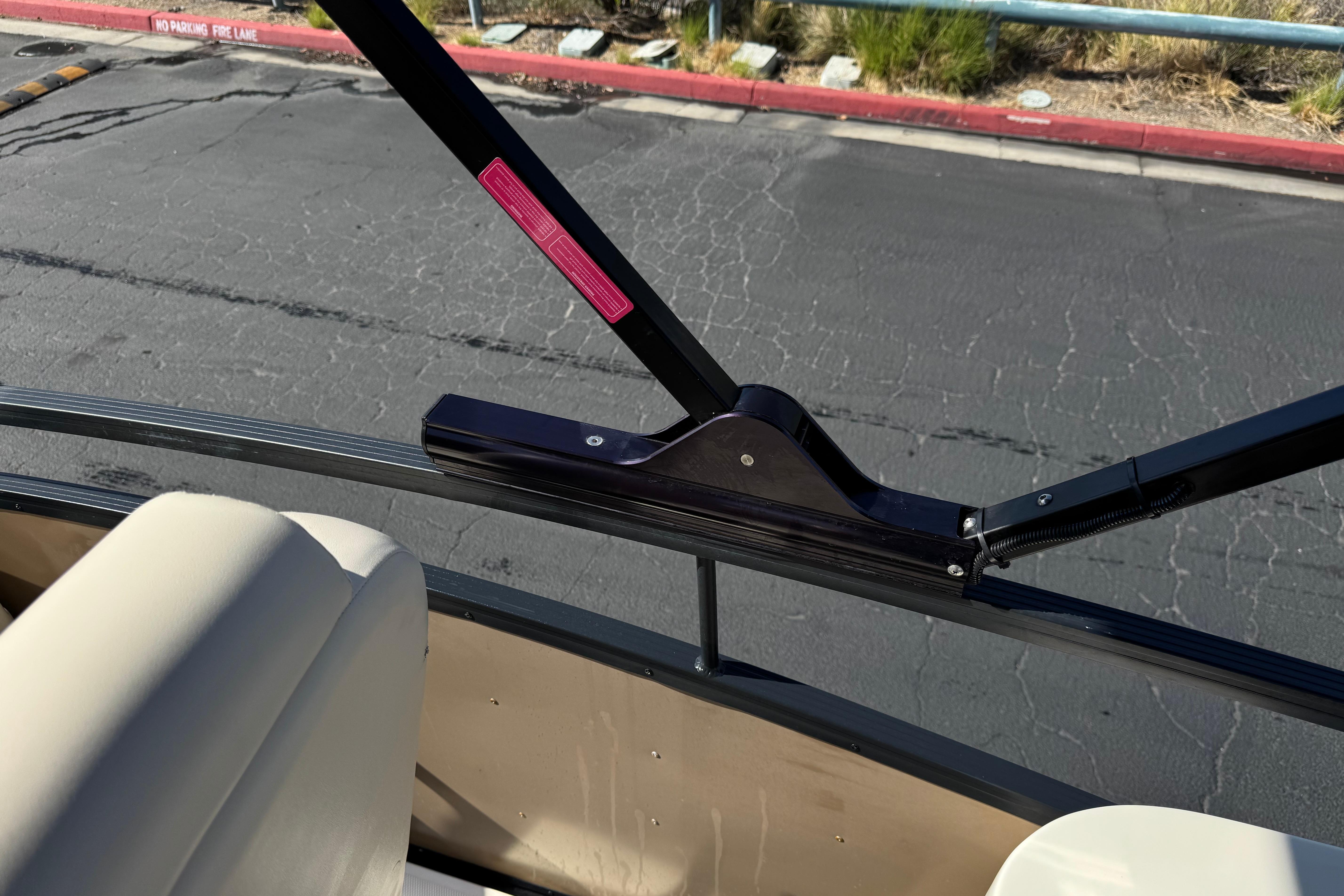 2023 Lexington 623 ST Xtreme boat interior with beige seating and black railing.