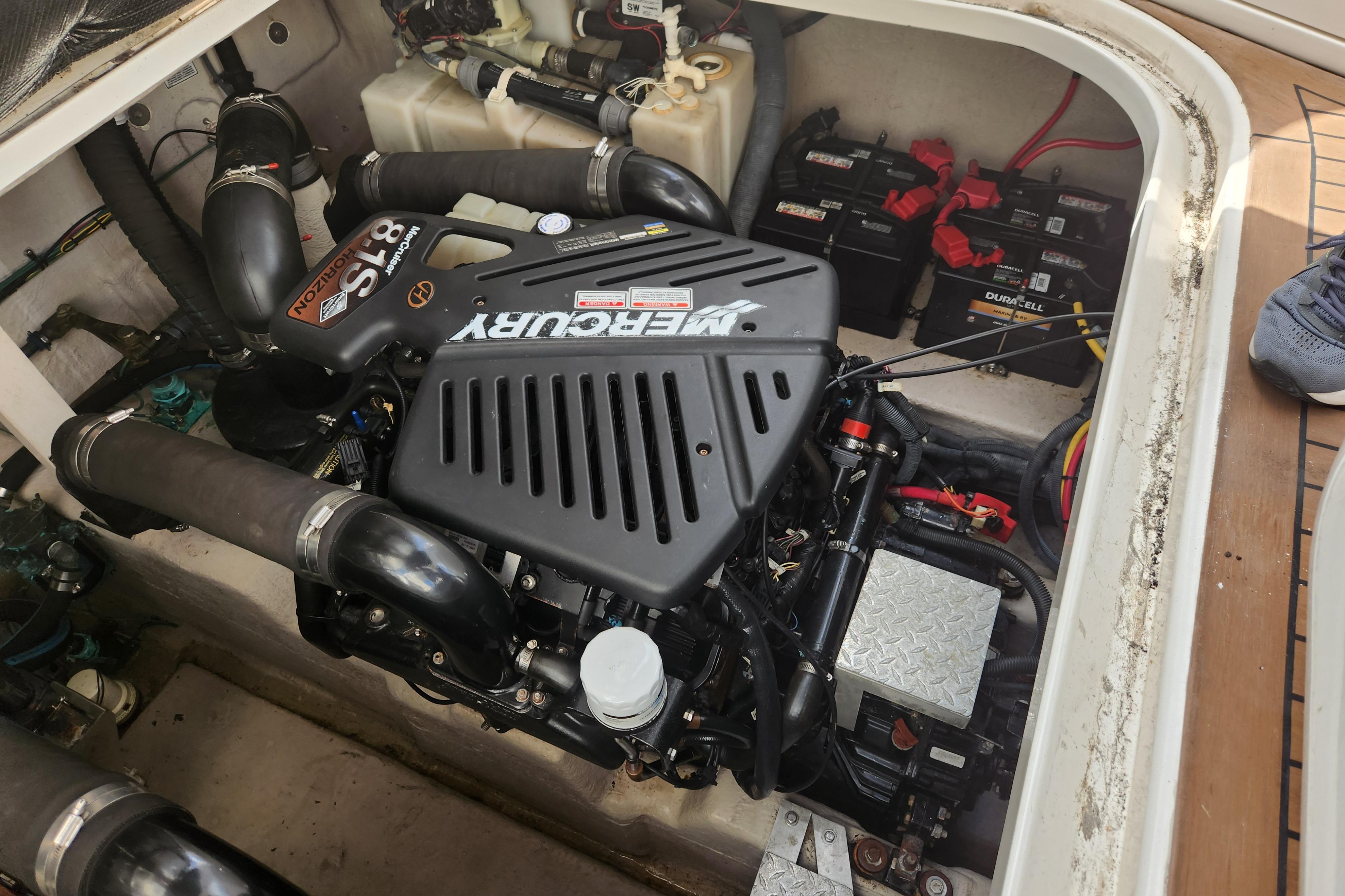 Engine compartment of a 2003 Sea Ray 360 Sundancer with MerCruiser engine and batteries.