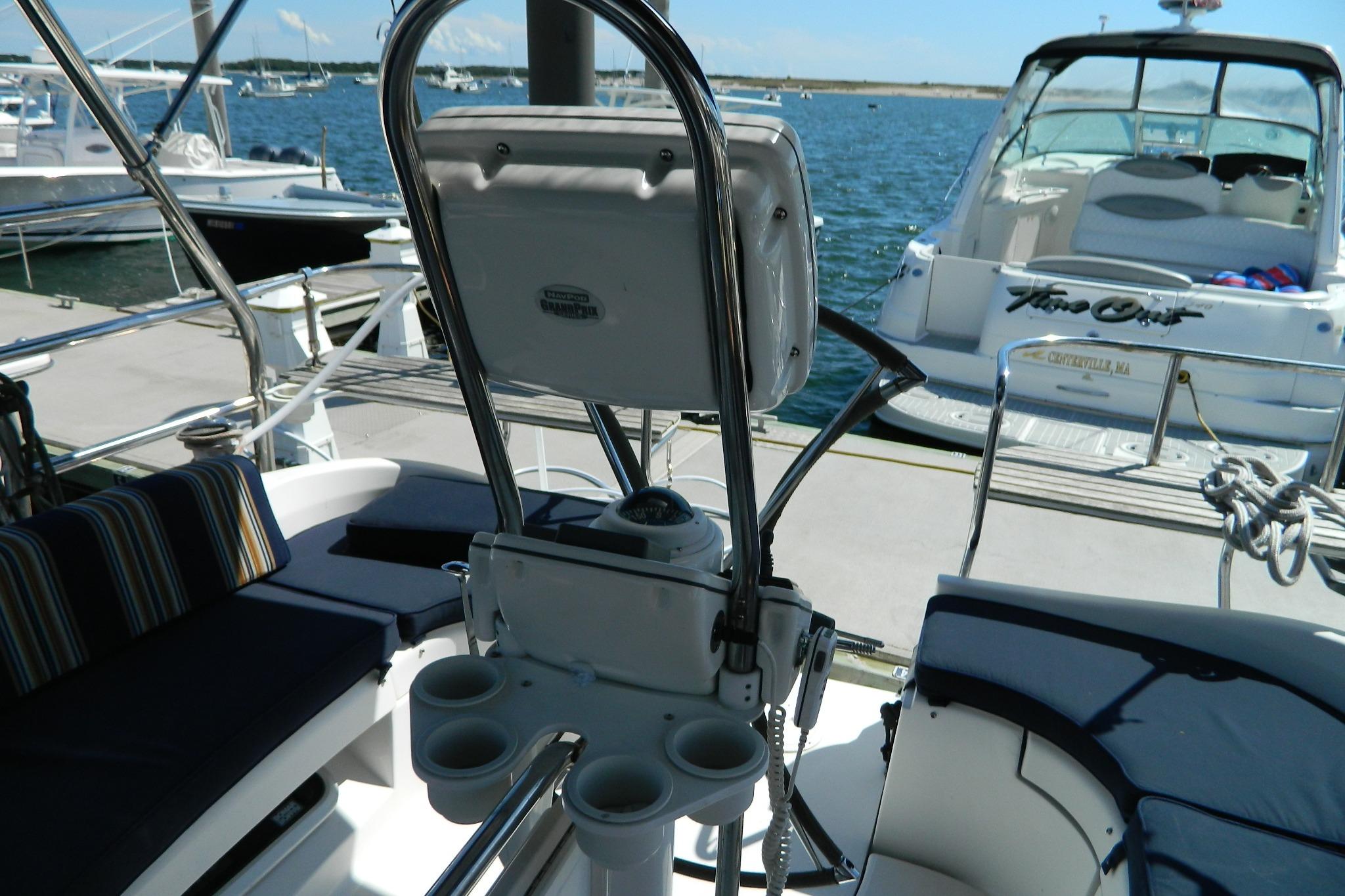 Cockpit view of 2007 Hunter 41 AC sailboat with seating and steering wheel.