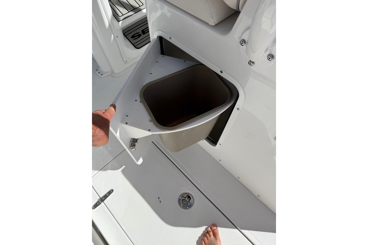 2026 Sea Hunt Ultra 285 Coffin Box with open storage compartment.