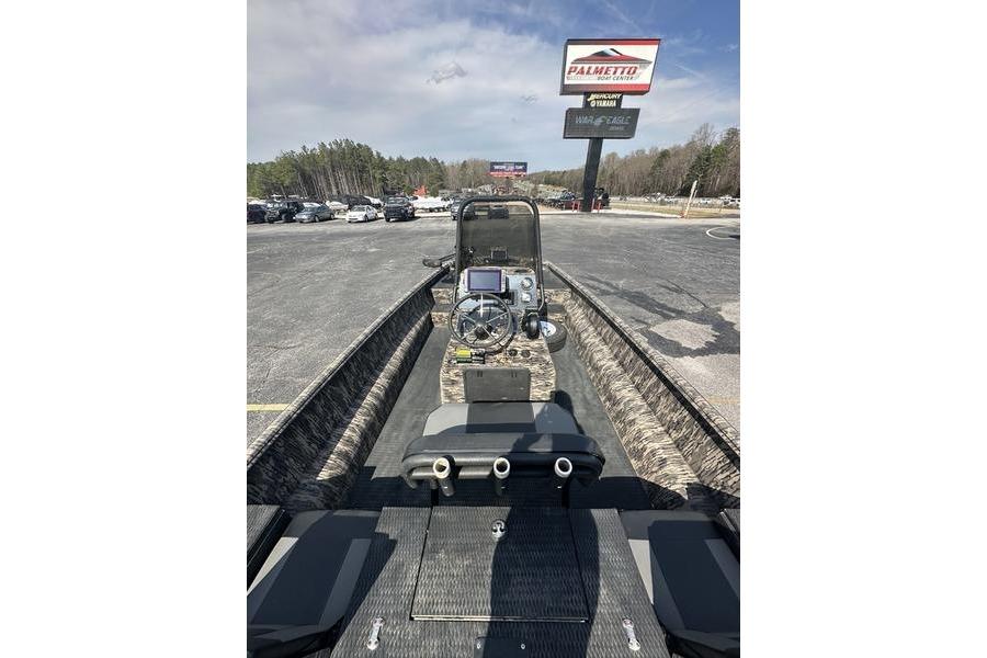 2023 Havoc 1756 MRST boat with camo interior, parked at dealership lot.