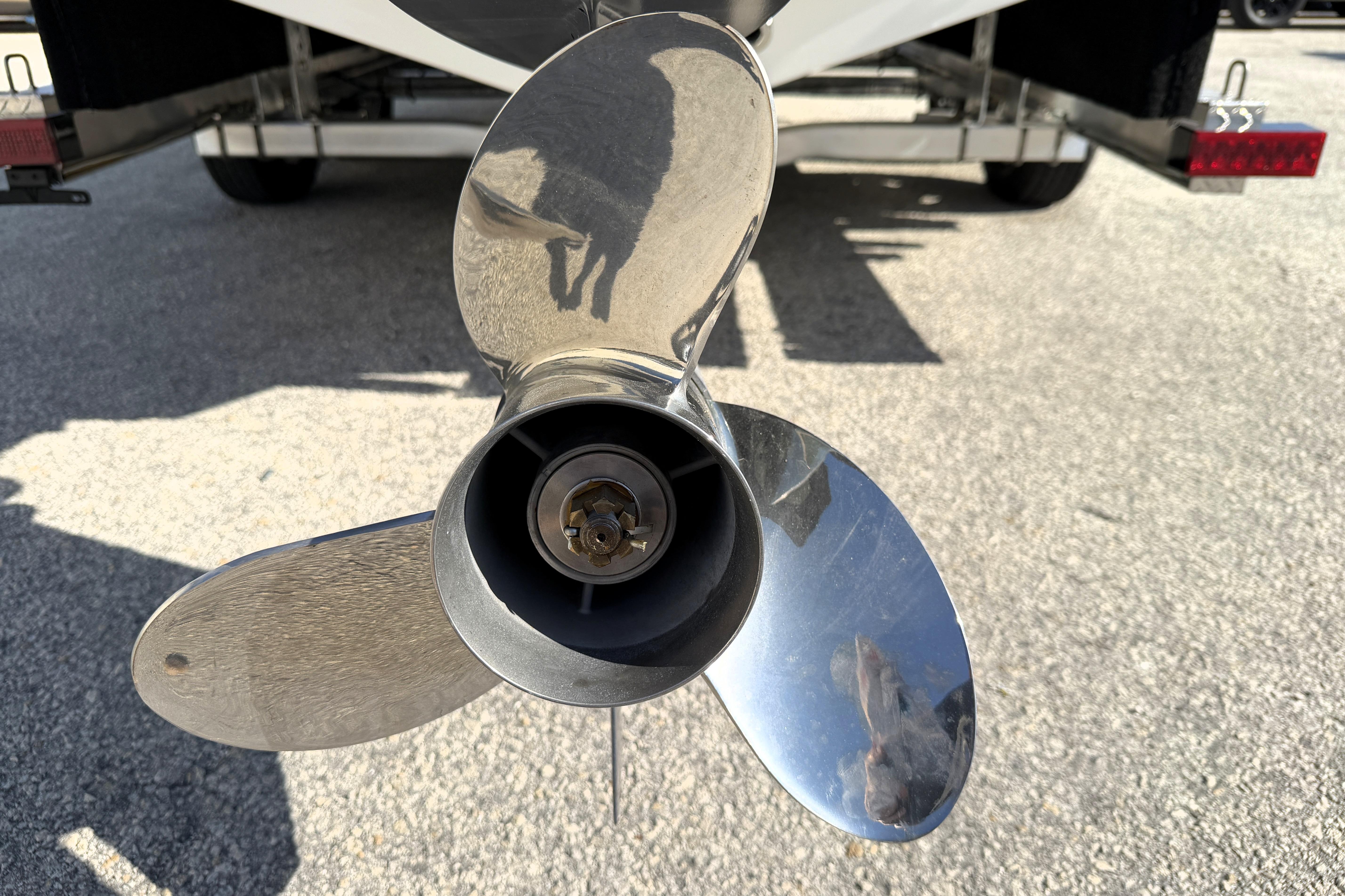 Close-up of a 2025 Key West 239 FS boat propeller on a trailer.