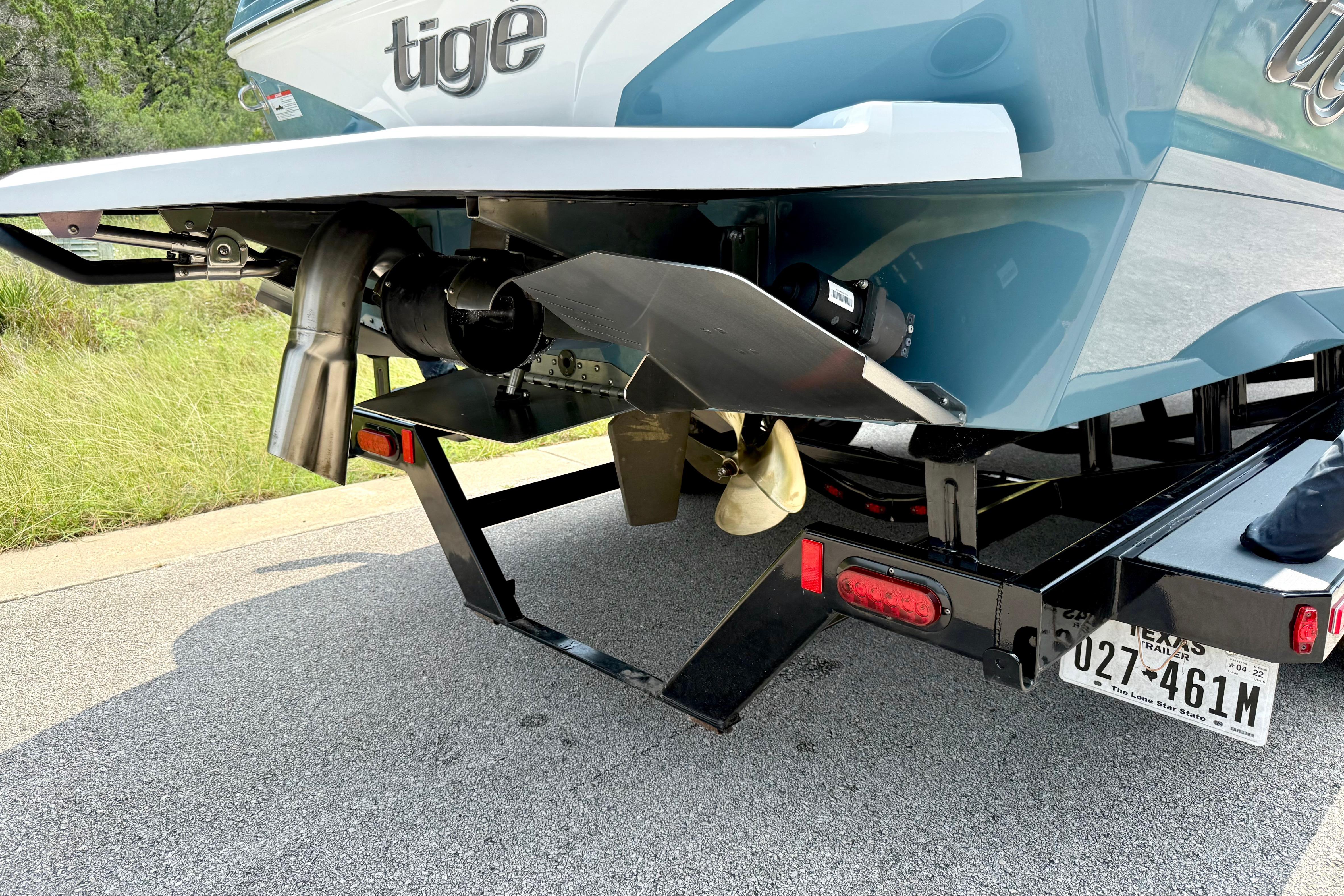 2021 Tige Z3 boat on trailer, showcasing rear design and propeller details.