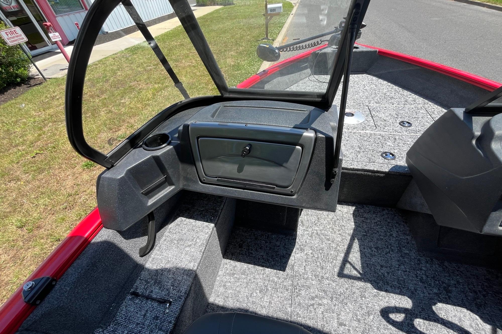 2026 Tracker Pro Guide V-16 WT boat interior with windshield and storage compartment.