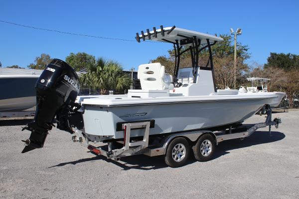 2025 East Cape 25 Open boat on trailer with Suzuki outboard motor.