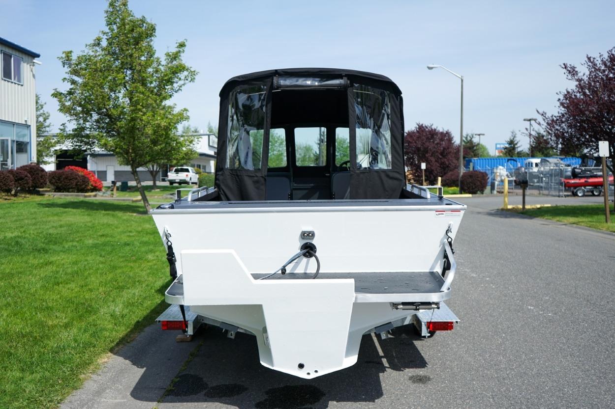 2026 Alumaweld X202 Styker boat, rear view, parked on a street.