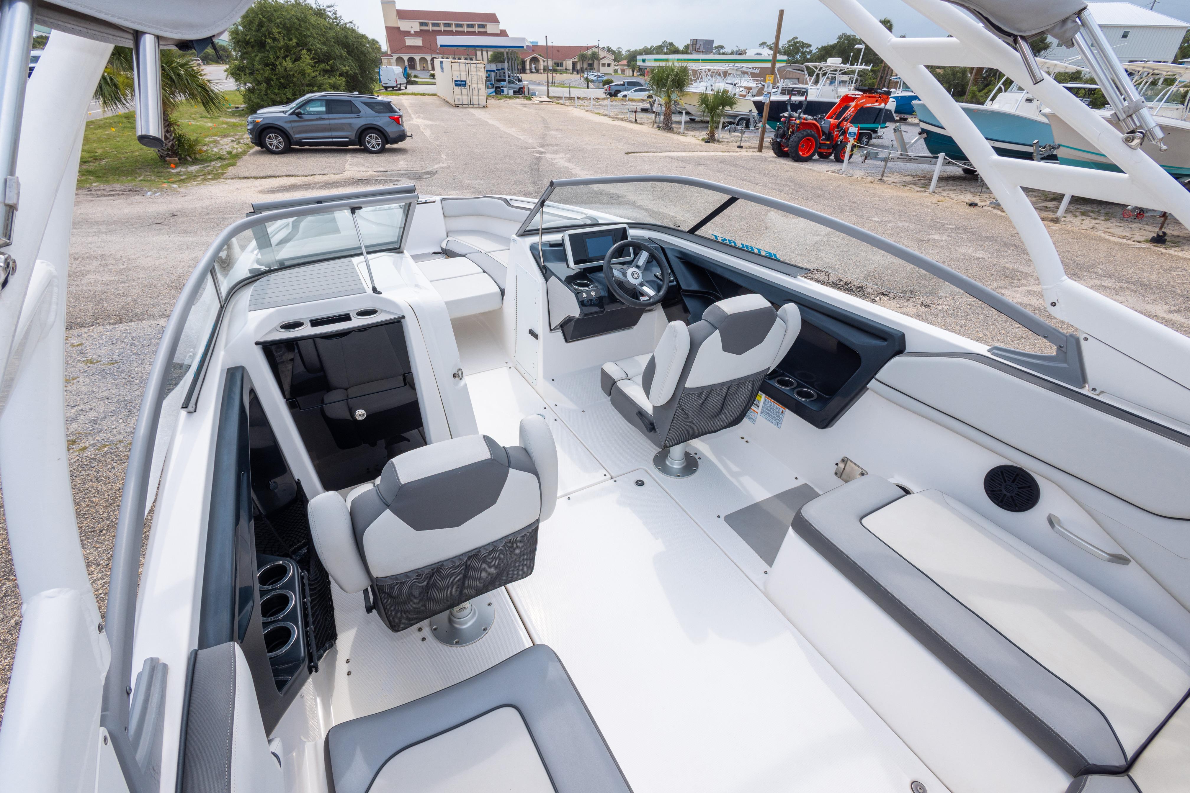 2021 Yamaha Boats AR250 interior with modern seating and sleek dashboard design.