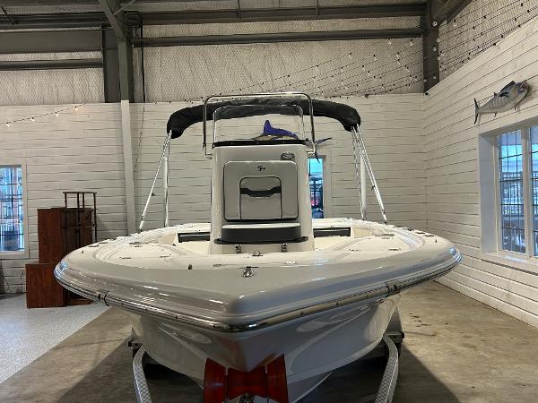 2025 Sea Pro 210 Bay boat in indoor showroom, front view.