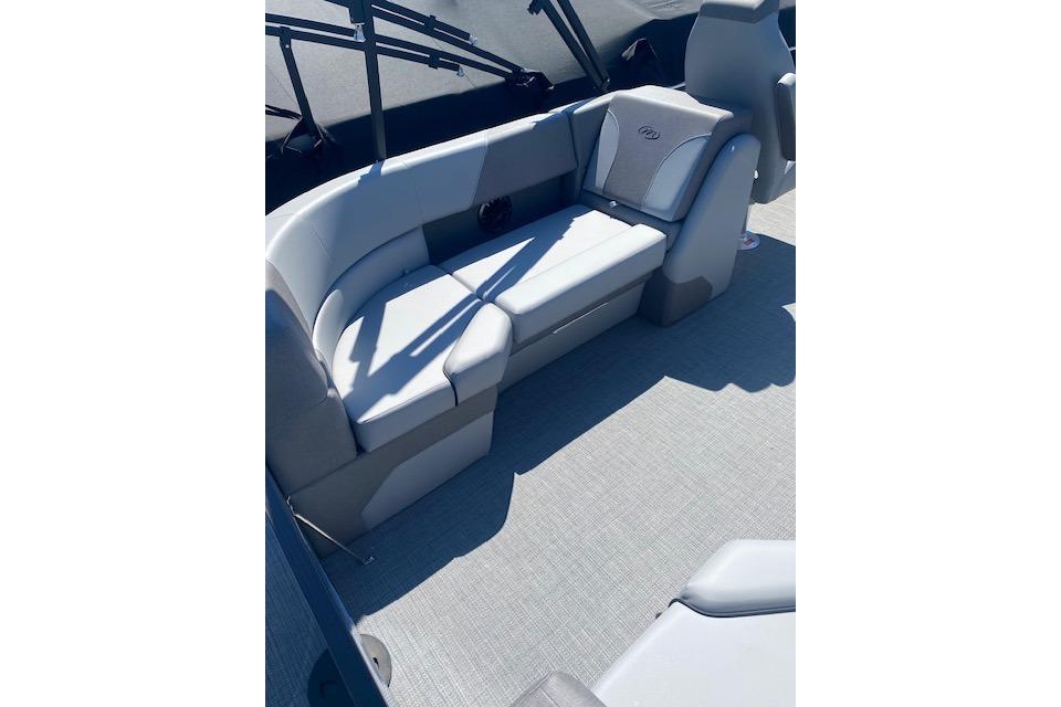 2026 Manitou 23 AURORA RF VPII 575 boat interior with gray seating and flooring.