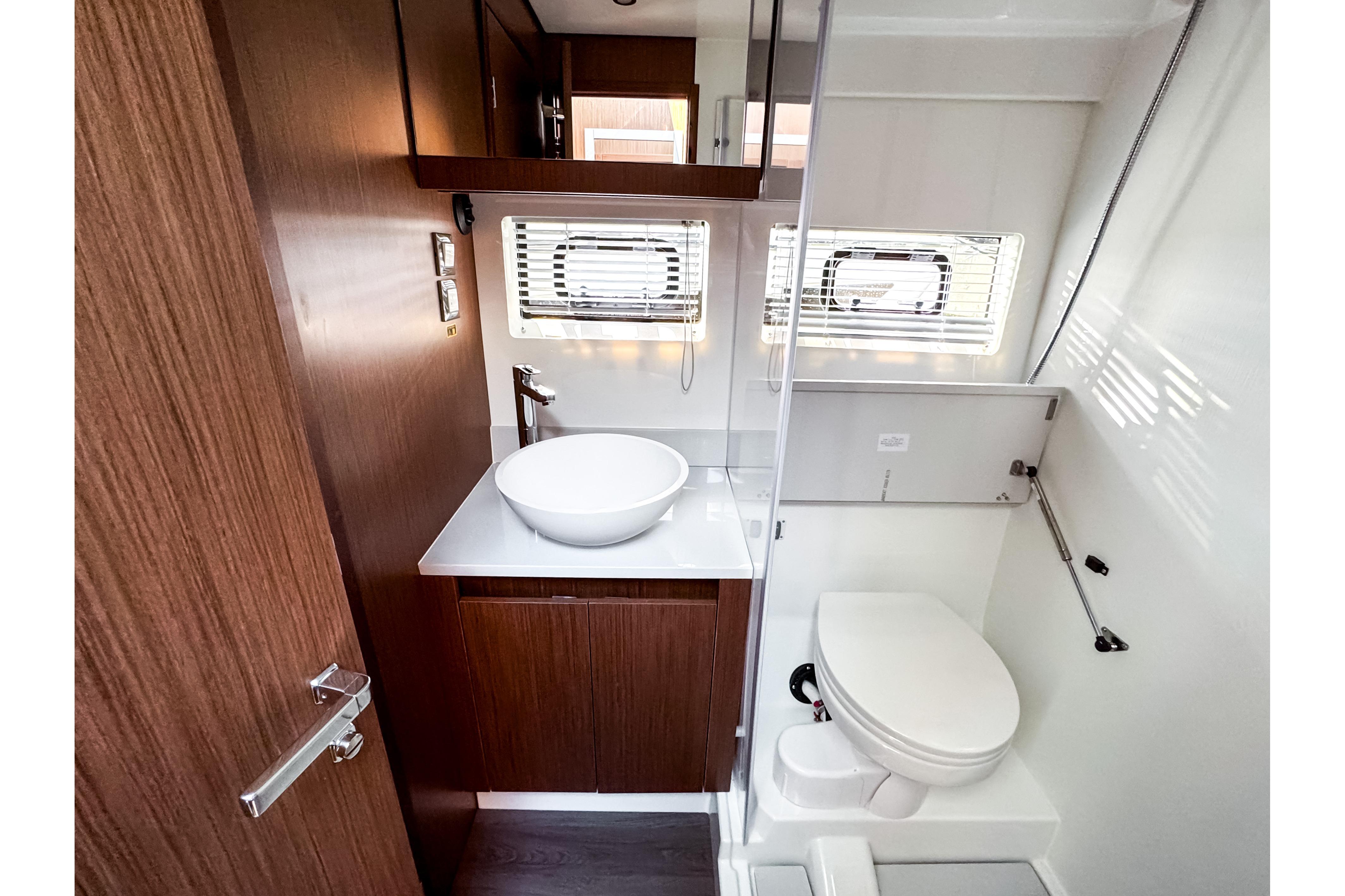 Interior view of 2026 Beneteau Antares 12 Coupe bathroom.