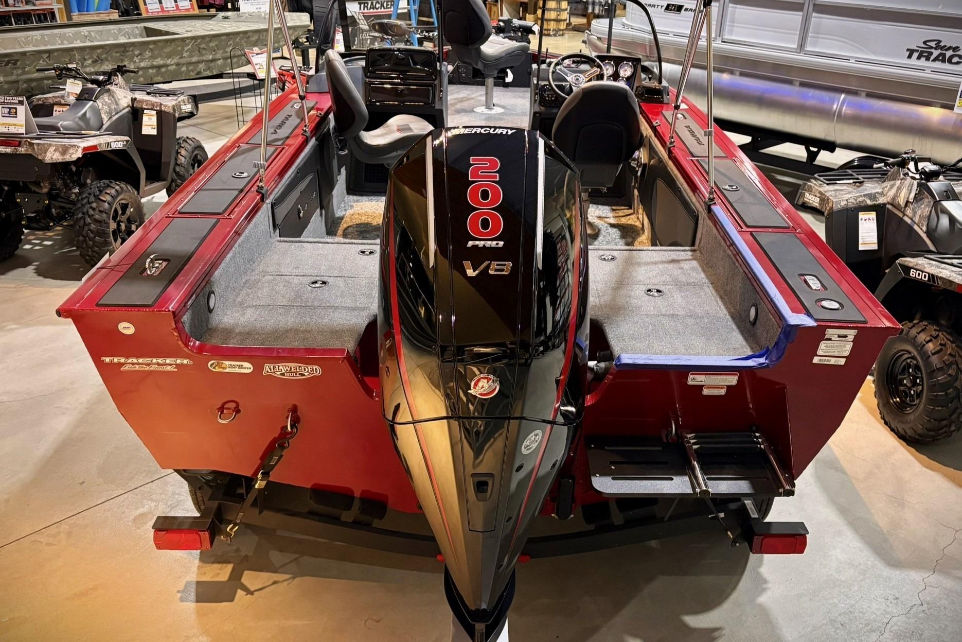 2025 Tracker Targa V-19 WT boat with Mercury 200 V8 engine, displayed indoors.