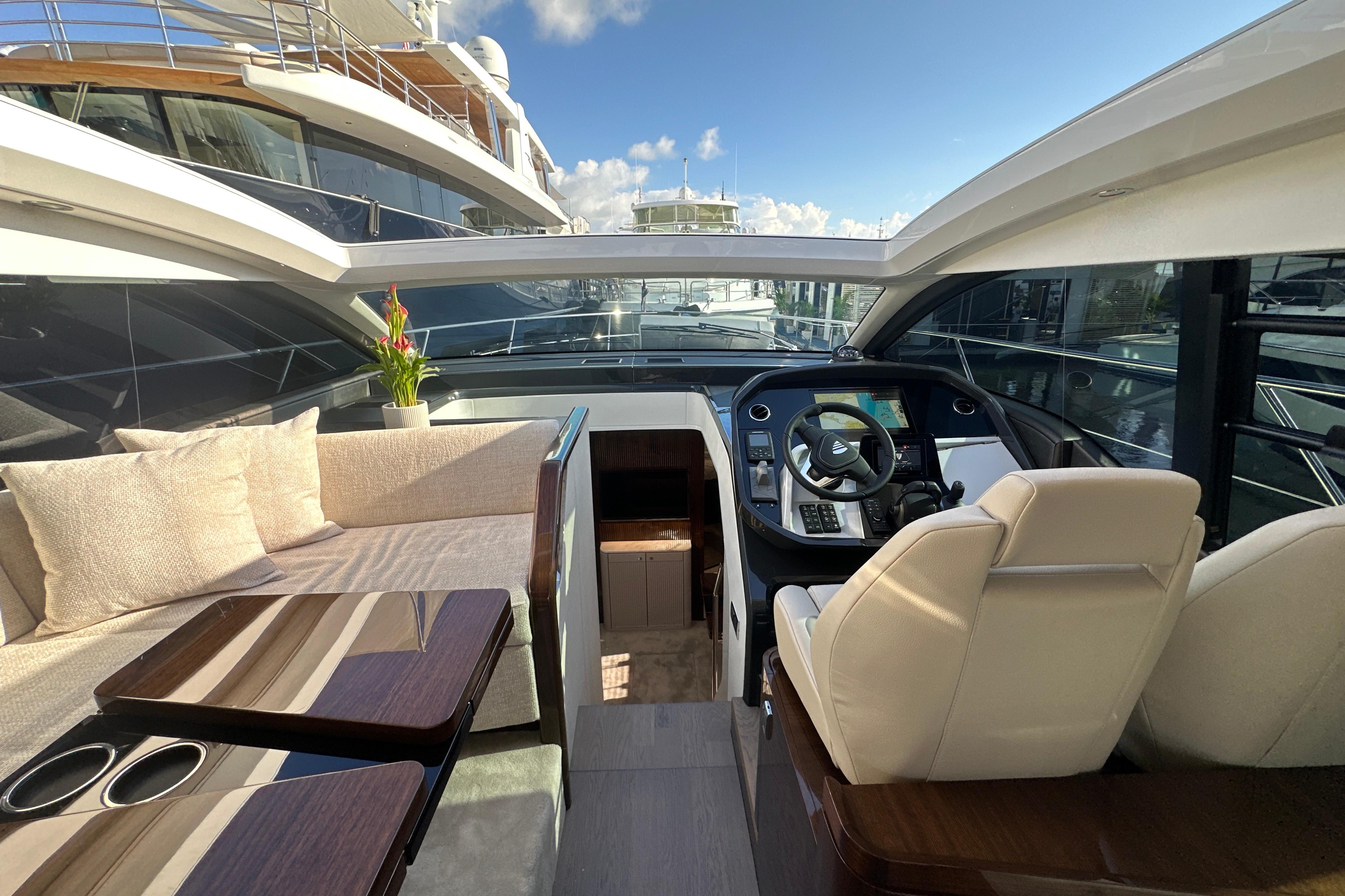 Interior view of 2026 Fairline Targa 47 GT yacht with luxurious seating and helm.