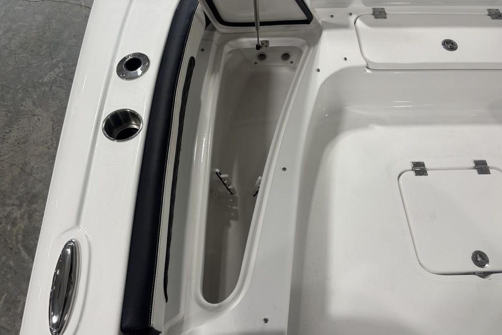 2026 Tidewater 2300 Carolina Bay boat interior with storage compartments and cup holders.
