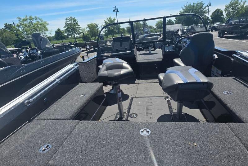 2026 Nitro ZV20 Pro boat interior with seating and control panel, parked outdoors.
