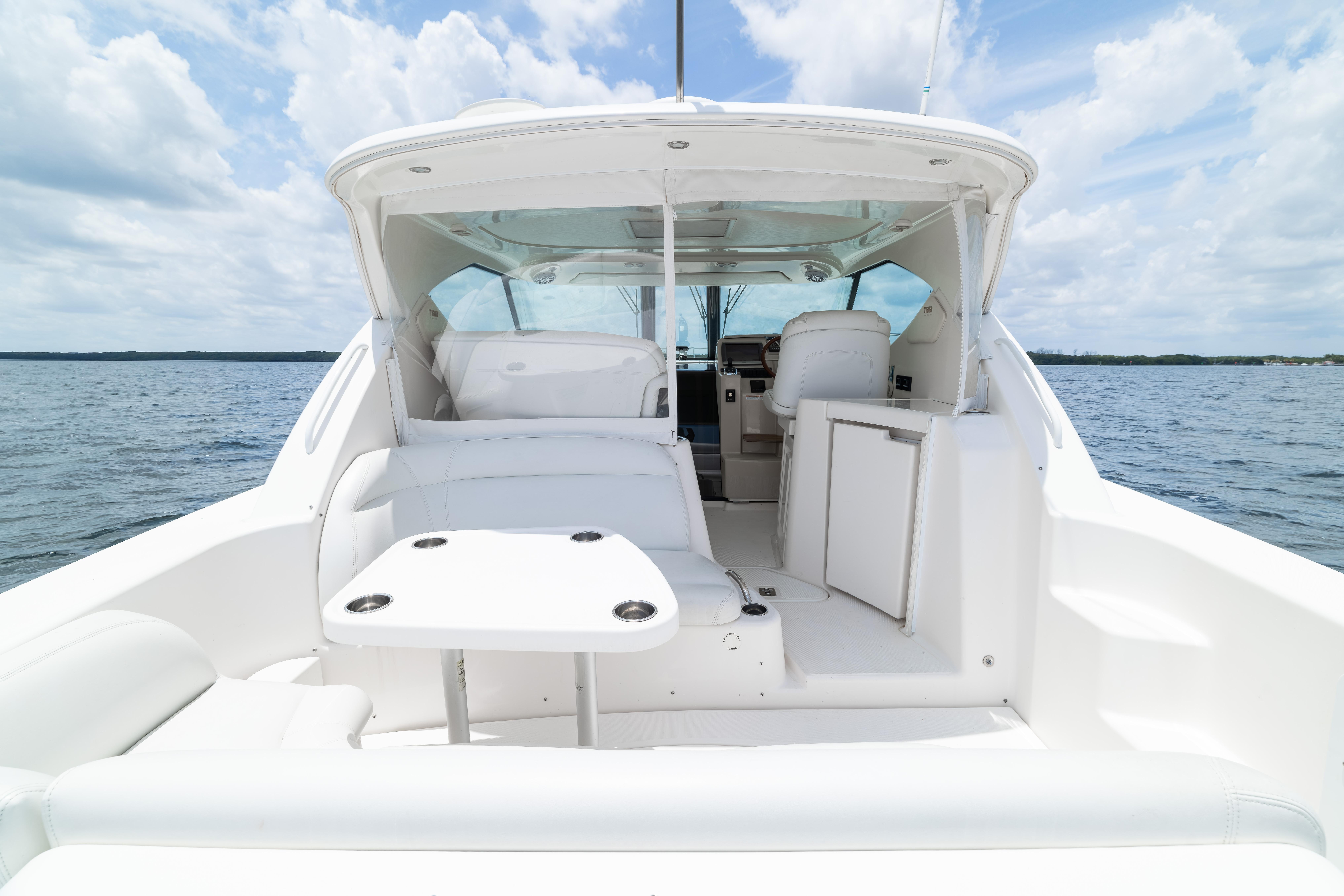 2010 Tiara Yachts 3500 Sovran LE interior with seating and table on open water.