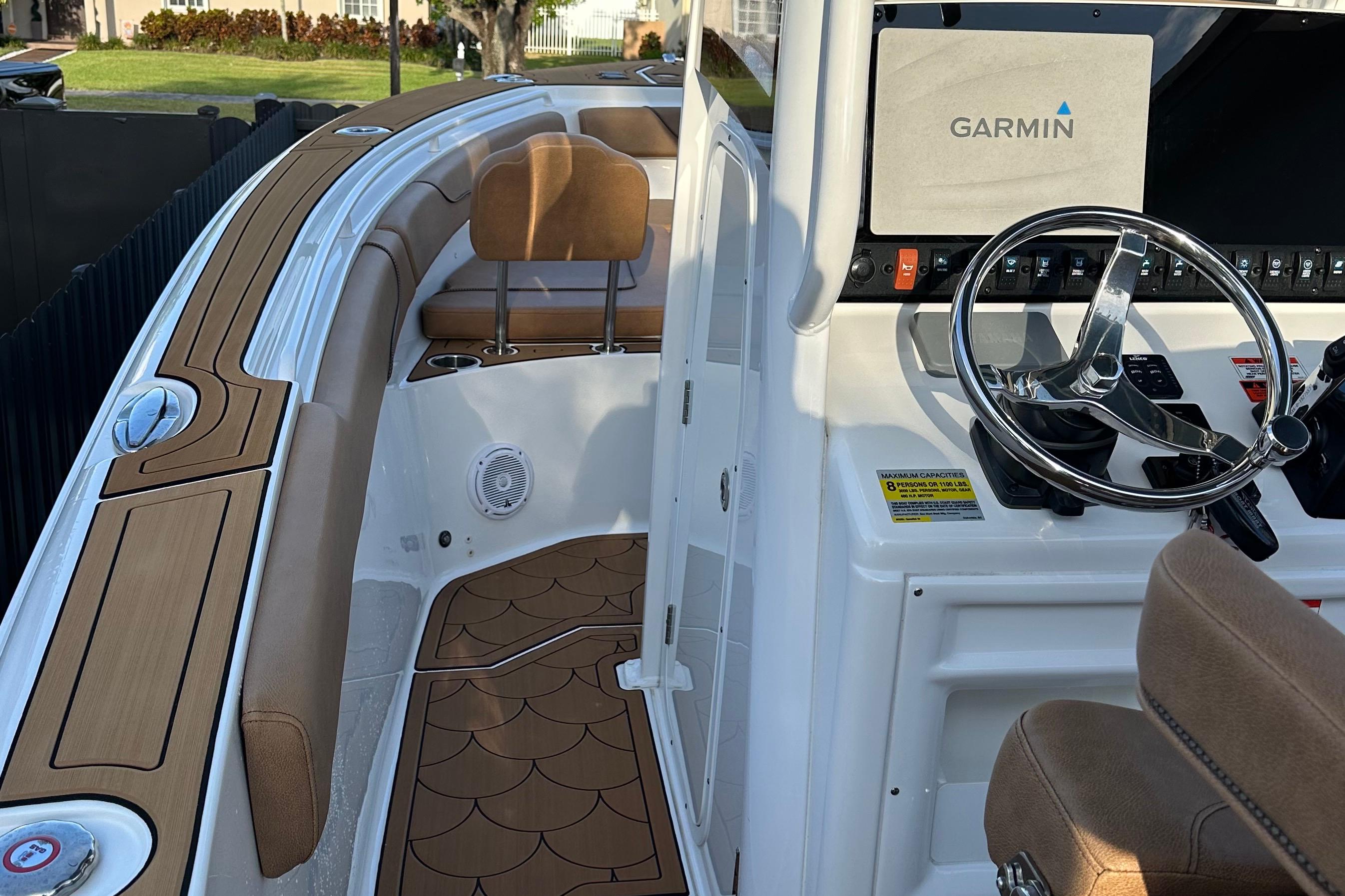 2019 Sea Hunt Gamefish 25 boat interior with Garmin navigation system and stylish seating.