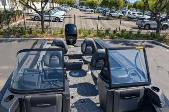 2026 Tracker Targa V-18 WT boat interior with seating and windshield, parked outdoors.