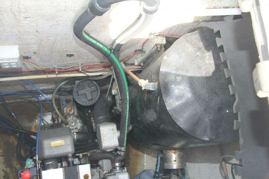 Engine compartment of 1995 Voyage Yachts Mayotte, showing mechanical components and wiring.