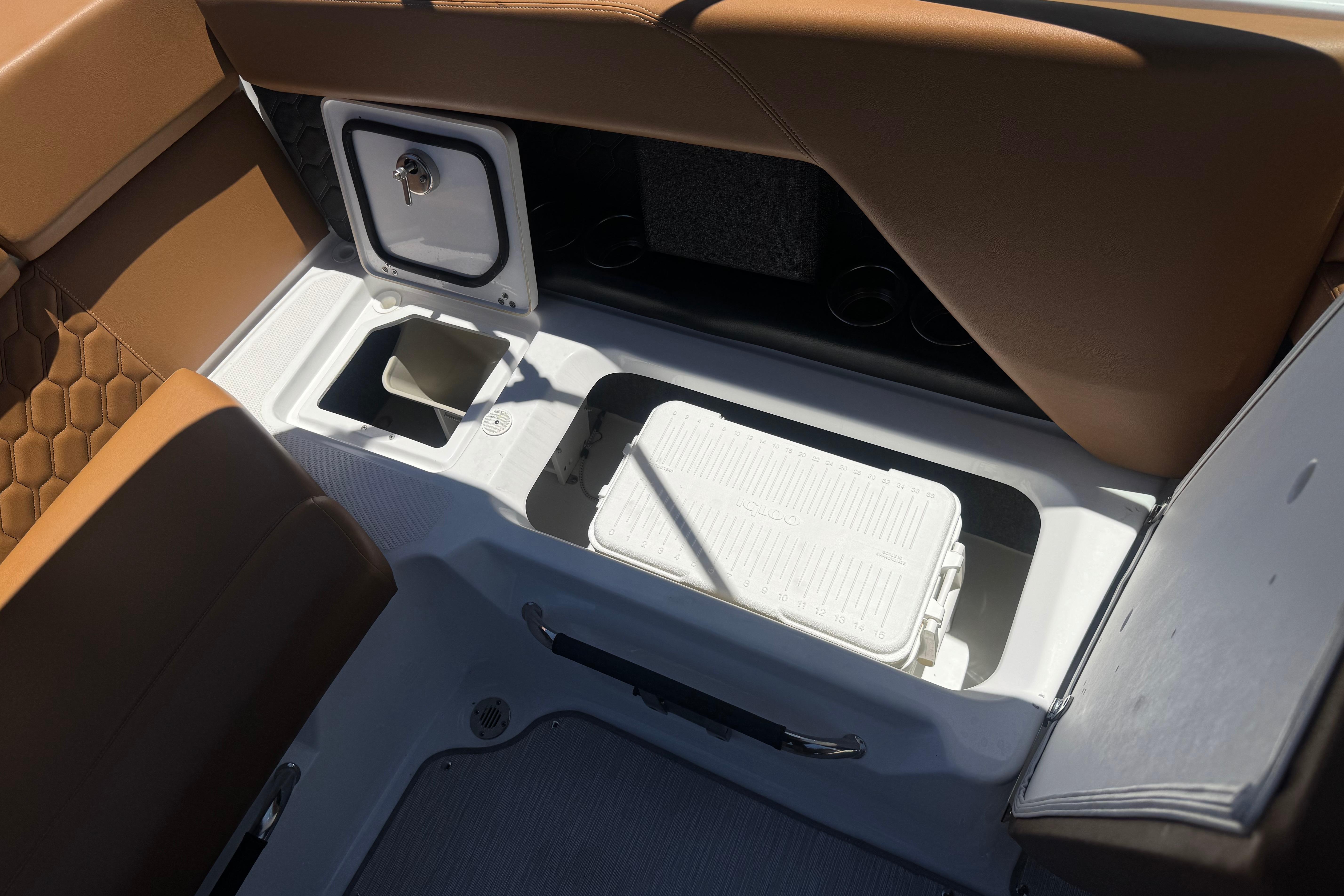 2022 Four Winns H4 boat interior with storage compartments and seating.