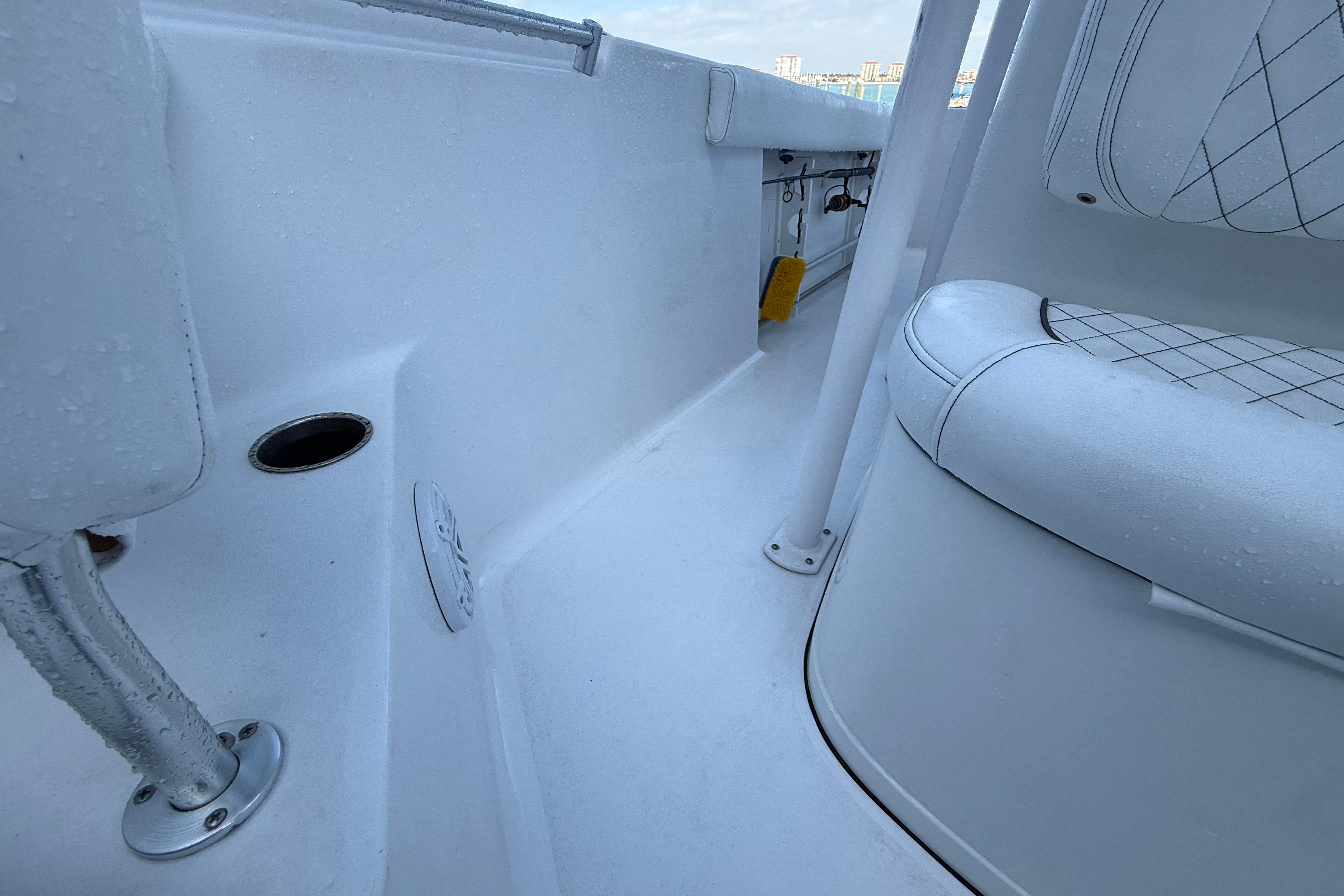 2022 Sportsman Open 232 Center Console interior with white seating and deck details.